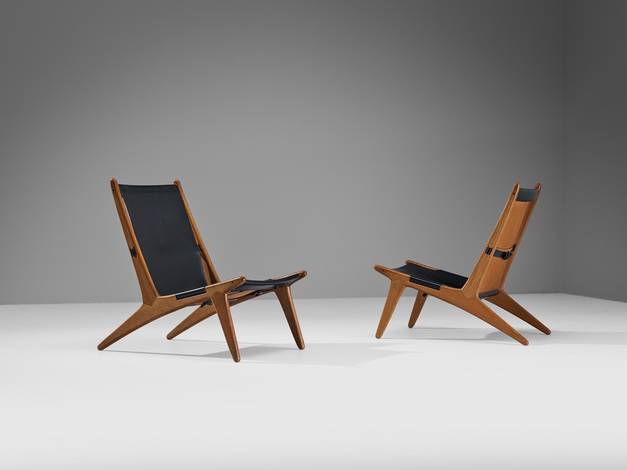 Uno & Östen Kristiansson for Luxus, pair of hunting chairs, model '204', leather, oak, Sweden, 1954

Swedish hunting chairs designed by Uno & Östen Kristiansson in the fifties. This unique design has a very strong appearance and easily catches the