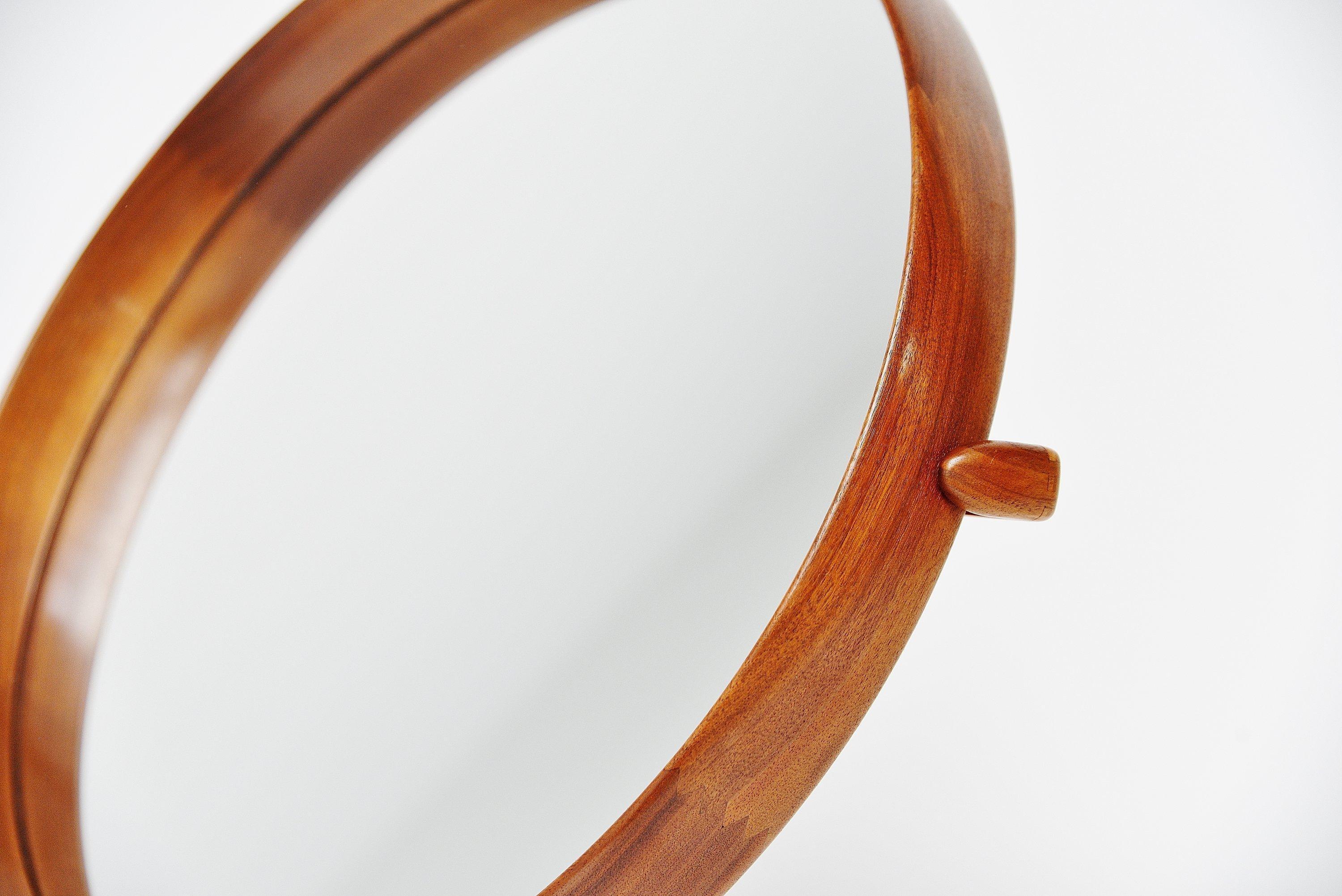 Scandinavian modern teak vanity table mirror designed by Uno and Osten Kristiansson and manufactured by Luxus, Sweden, 1960. This solid teak mirror is very well crafted with nice dovetail connections in the rim and tripod base. Hold by a