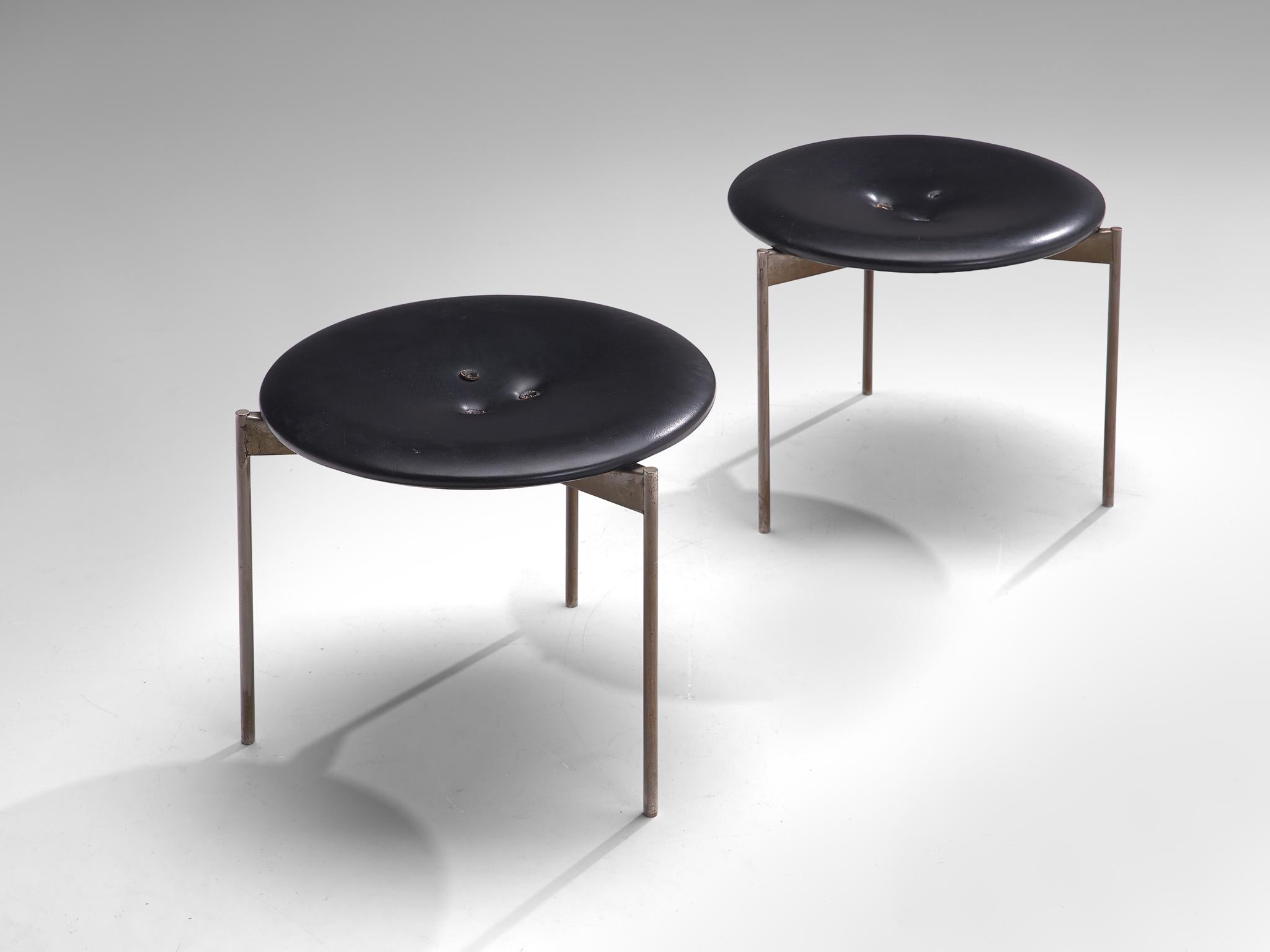 Uno & Östen Kristiansson for Luxus, pair of stools, steel and leather, Sweden, 1960s.

A Midcentury Modern set of two low stools that are designed by the duo Uno & Östen Kristiansson. This Swedish seats were produced by Luxus, featuring the edition