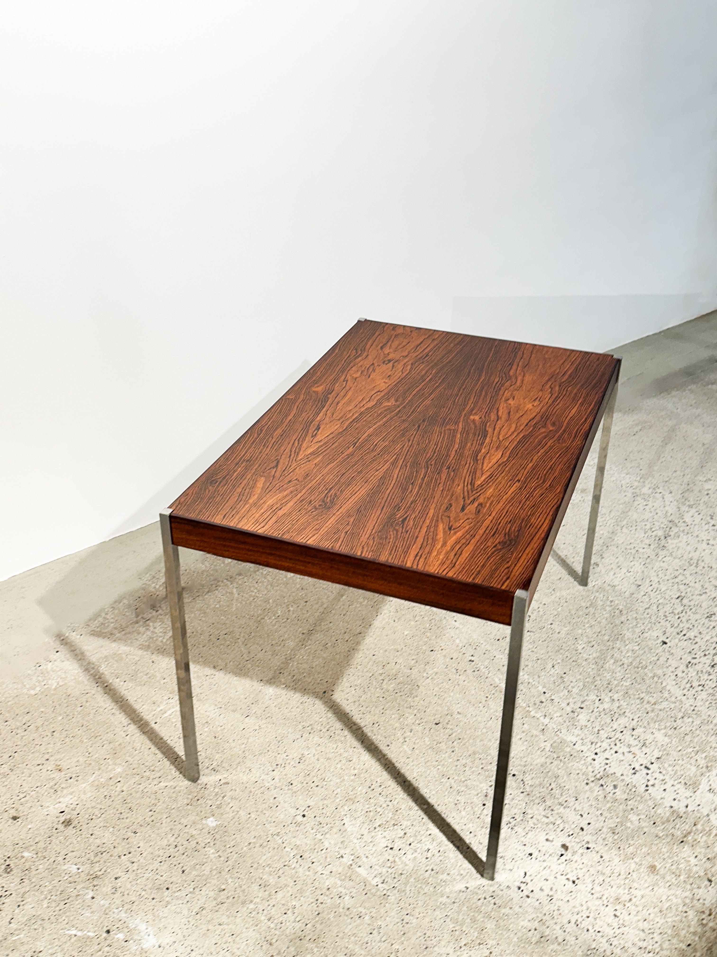 Side table designed by Uno & Östen Kristiansson, made of rosewood with delicate steel legs, made by Luxus in Vittsjö, Sweden in the 1960s.

Width: 60 cm
Depth: 40 cm
Height: 40 cm

Very good condition, refinished with semi-matte lacquer.