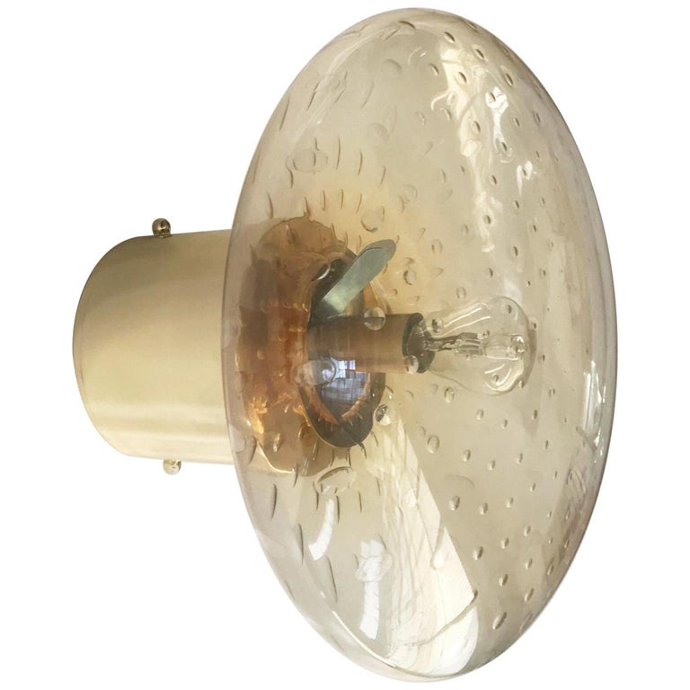 Italian modern wall light with amber Murano glass shade hand blown with bubbles inside the glass using Bollicine technique and chic polished brass finish / Designed by Fabio Bergomi for Fabio Ltd / Made in Italy
1 light / E12 or E14 type / max 40W