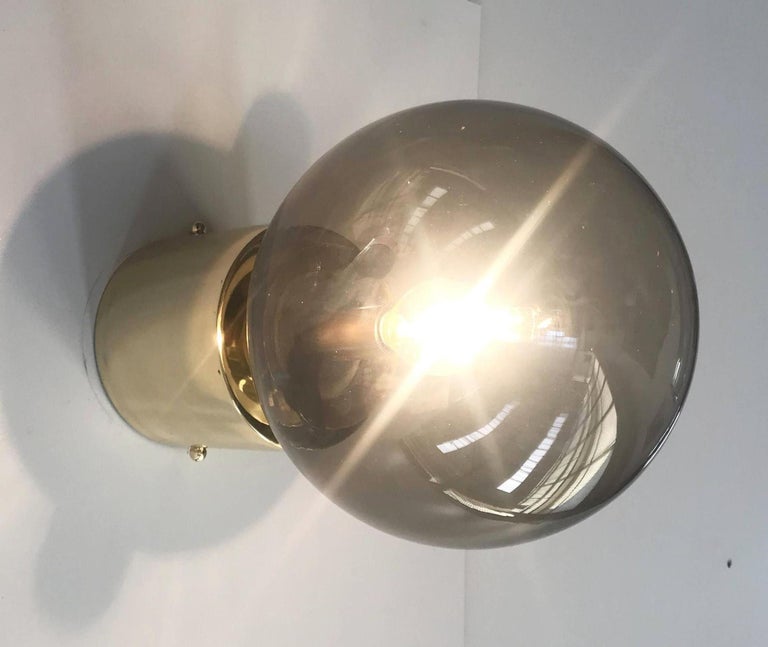 Italian modern wall light with smoky Murano glass globe and chic polished brass finish / Designed by Fabio Bergomi for Fabio Ltd / Made in Italy
1 light / E12 or E14 type / max 40W
Depth: 12.5 inches / Height: 8 inches / Width: 8 inches
Order only /