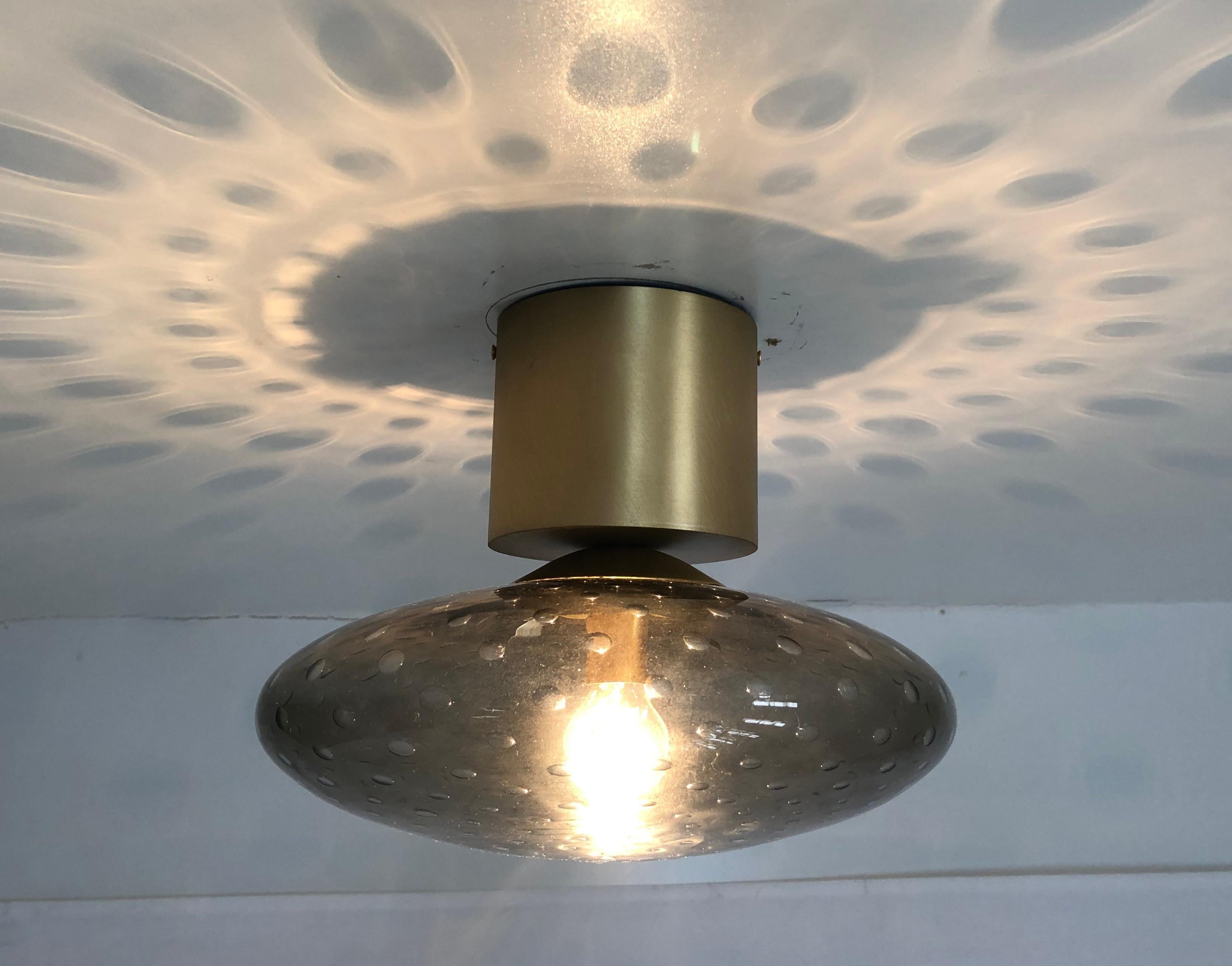 Italian flush mount with Murano glass shade and brass frame / Made in Italy
Designed by Fabio Ltd, inspired by Angelo Lelli and Arredoluce styles
1 light / E12 or E14 type / max 40W each
Diameter: 12 inches / Height: 9.5 inches
Order only / This