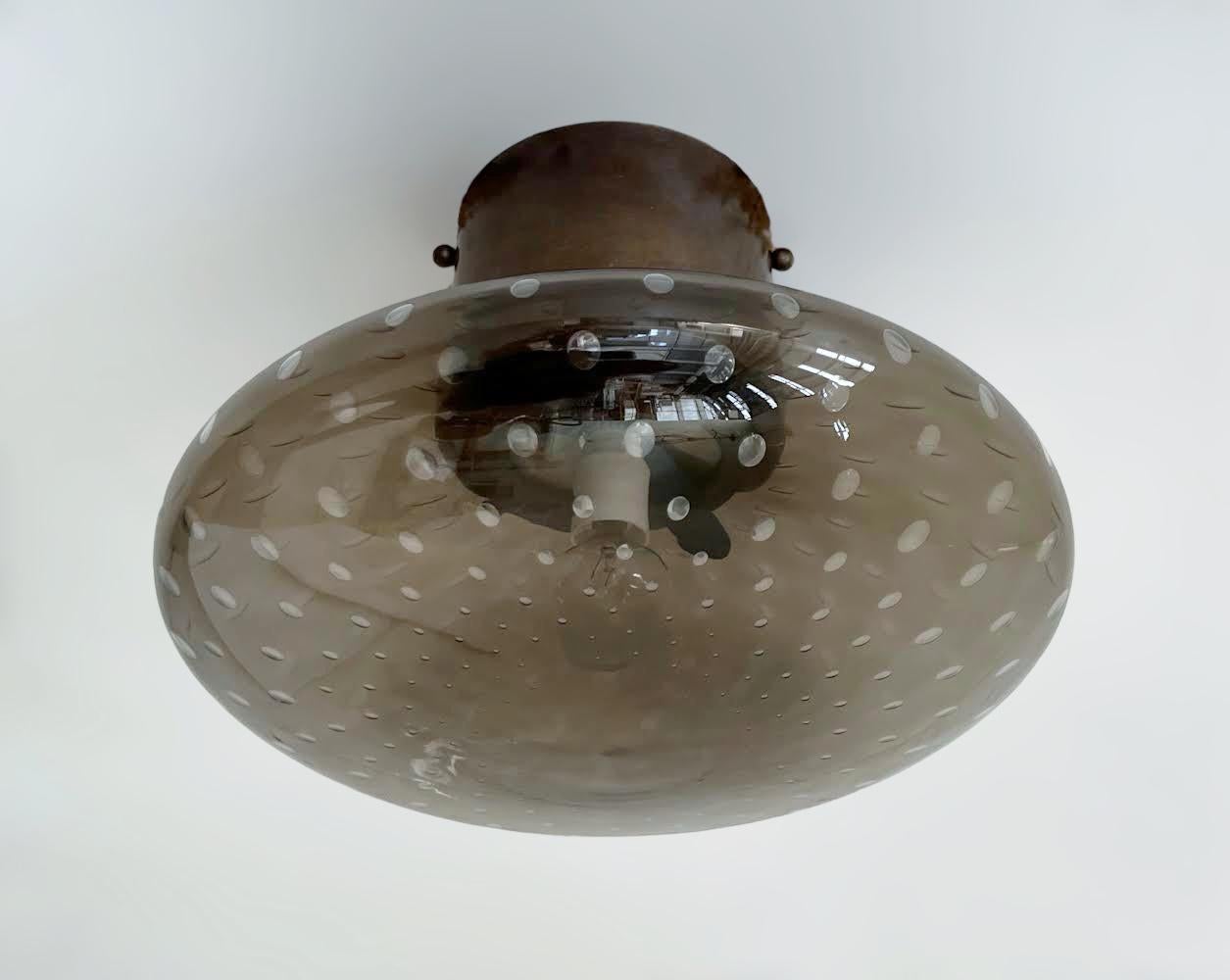 Italian flush mount with Murano glass shade and brass frame shown in bronzed finish / Made in Italy
Designed by Fabio Ltd, inspired by Angelo Lelli and Arredoluce styles
1 light / E12 or E14 type / max 40W each
Diameter: 12 inches / Height: 9.5