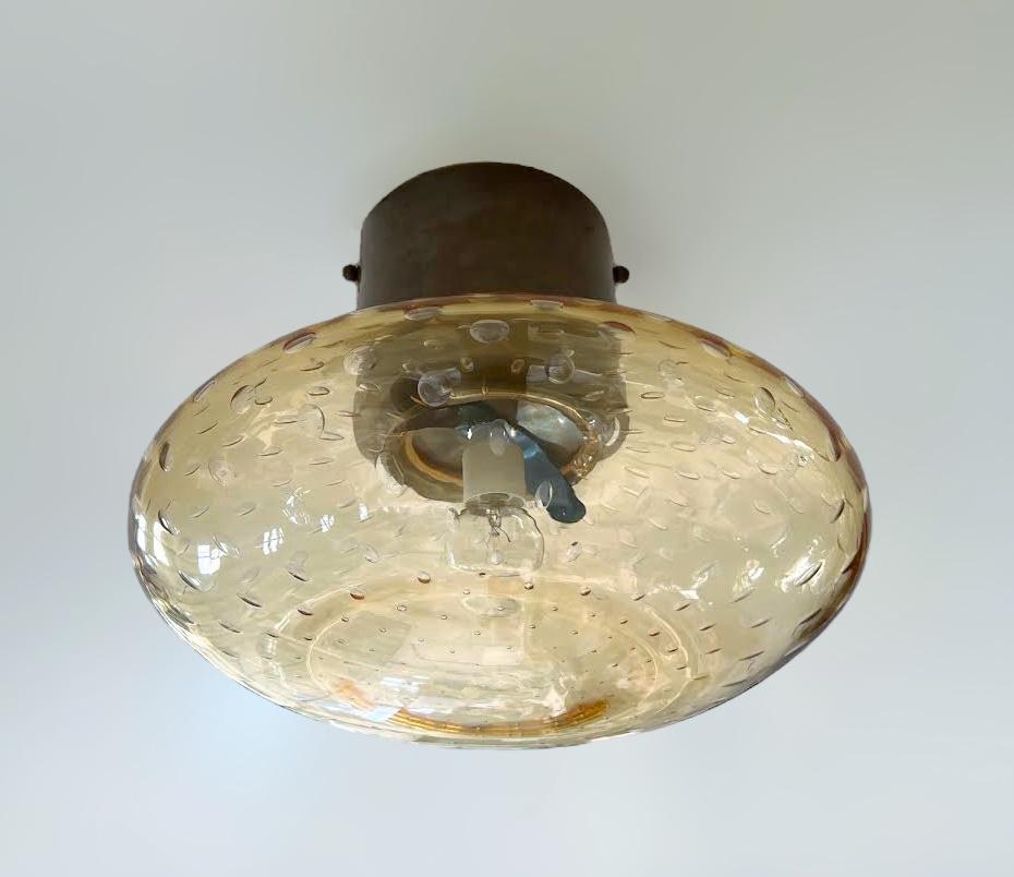 Italian flush mount with Murano glass shade and brass frame shown in bronzed finish / Made in Italy
Designed by Fabio Ltd, inspired by Angelo Lelli and Arredoluce styles
1 light / E12 or E14 type / max 40W each
Diameter: 12 inches / Height: 9.5