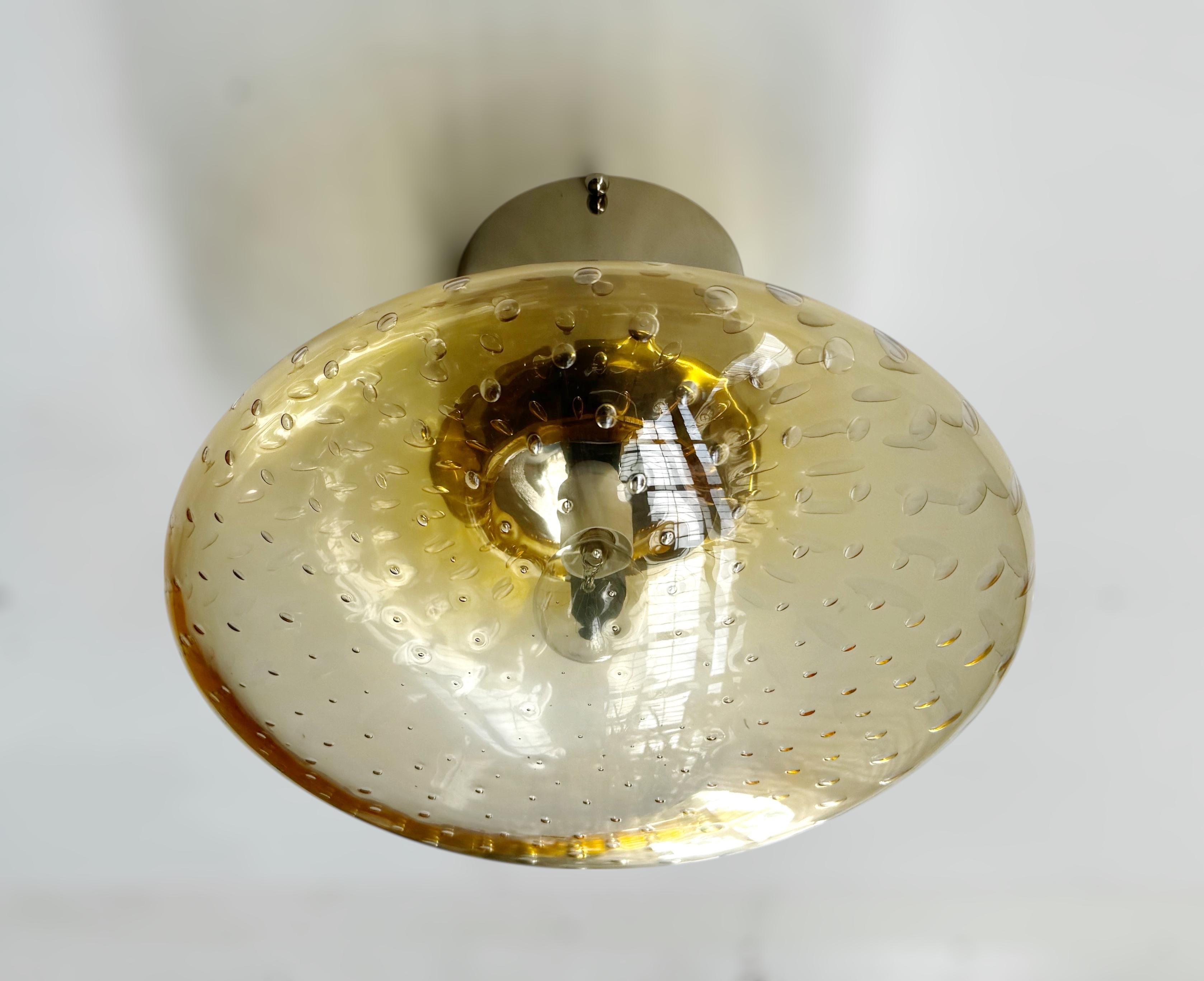 Italian flush mount with Murano glass shade and brass frame shown in polished nickel finish / Made in Italy
Designed by Fabio Ltd, inspired by Angelo Lelli and Arredoluce styles
1 light / E12 or E14 type / max 40W each
Diameter: 12 inches / Height: