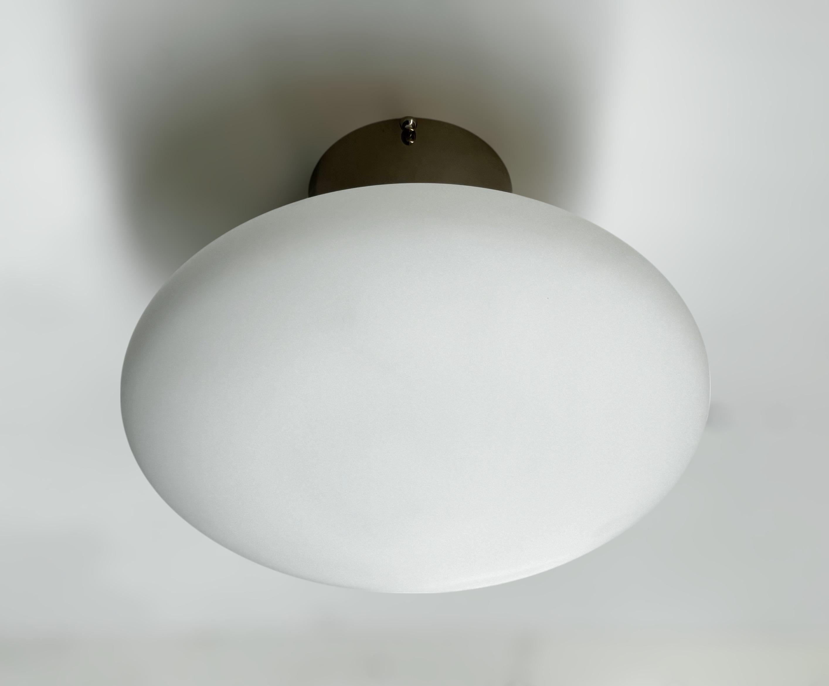 Italian flush mount with Murano glass shade and brass frame shown in polished nickel finish / Made in Italy
Designed by Fabio Ltd, inspired by Angelo Lelli and Arredoluce styles
1 light / E12 or E14 type / max 40W each
Diameter: 12 inches / Height:
