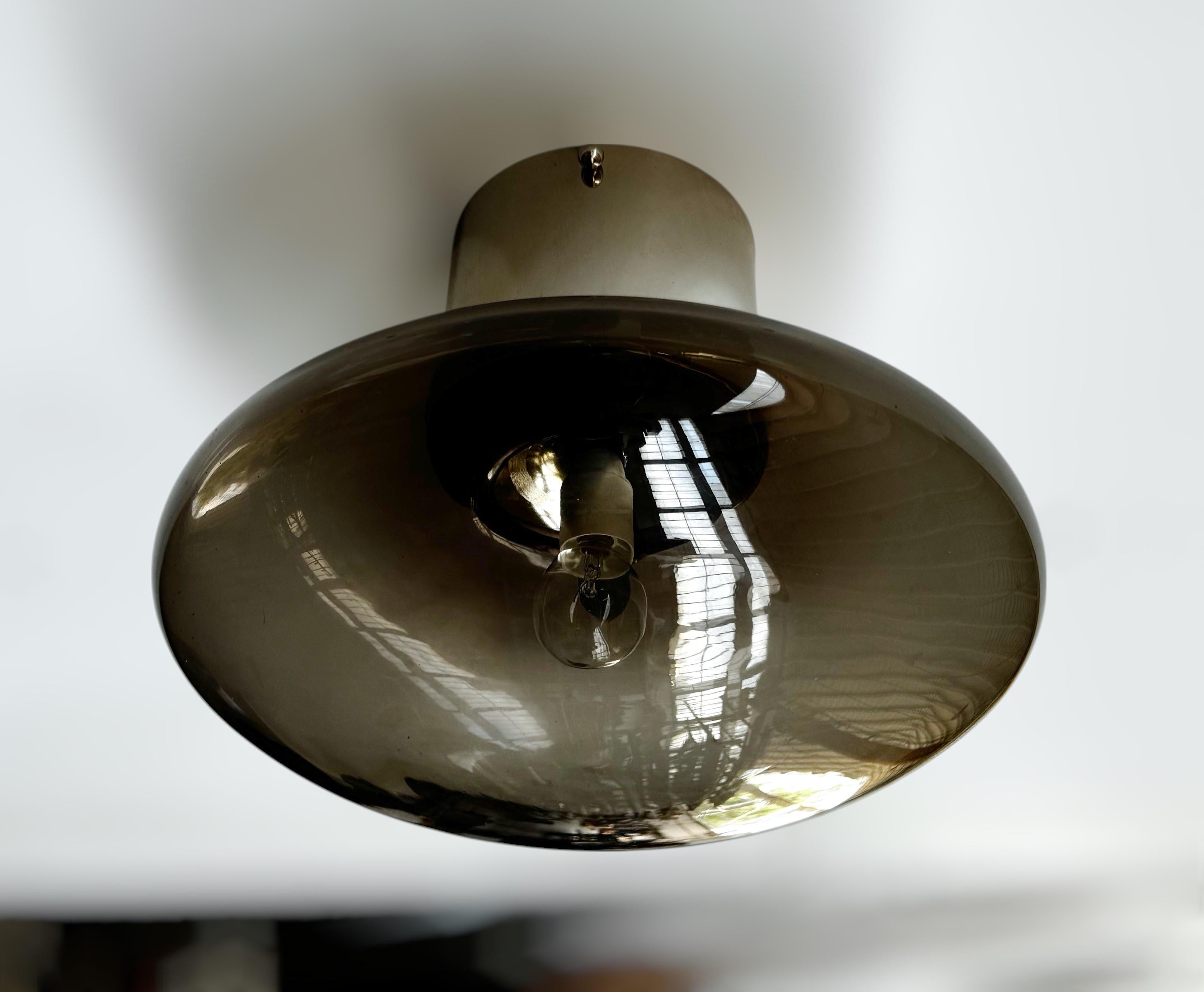Italian flush mount with Murano glass shade and brass frame shown in polished nickel finish / Made in Italy
Designed by Fabio Ltd, inspired by Angelo Lelli and Arredoluce styles
1 light / E12 or E14 type / max 40W each
Diameter: 12 inches / Height: