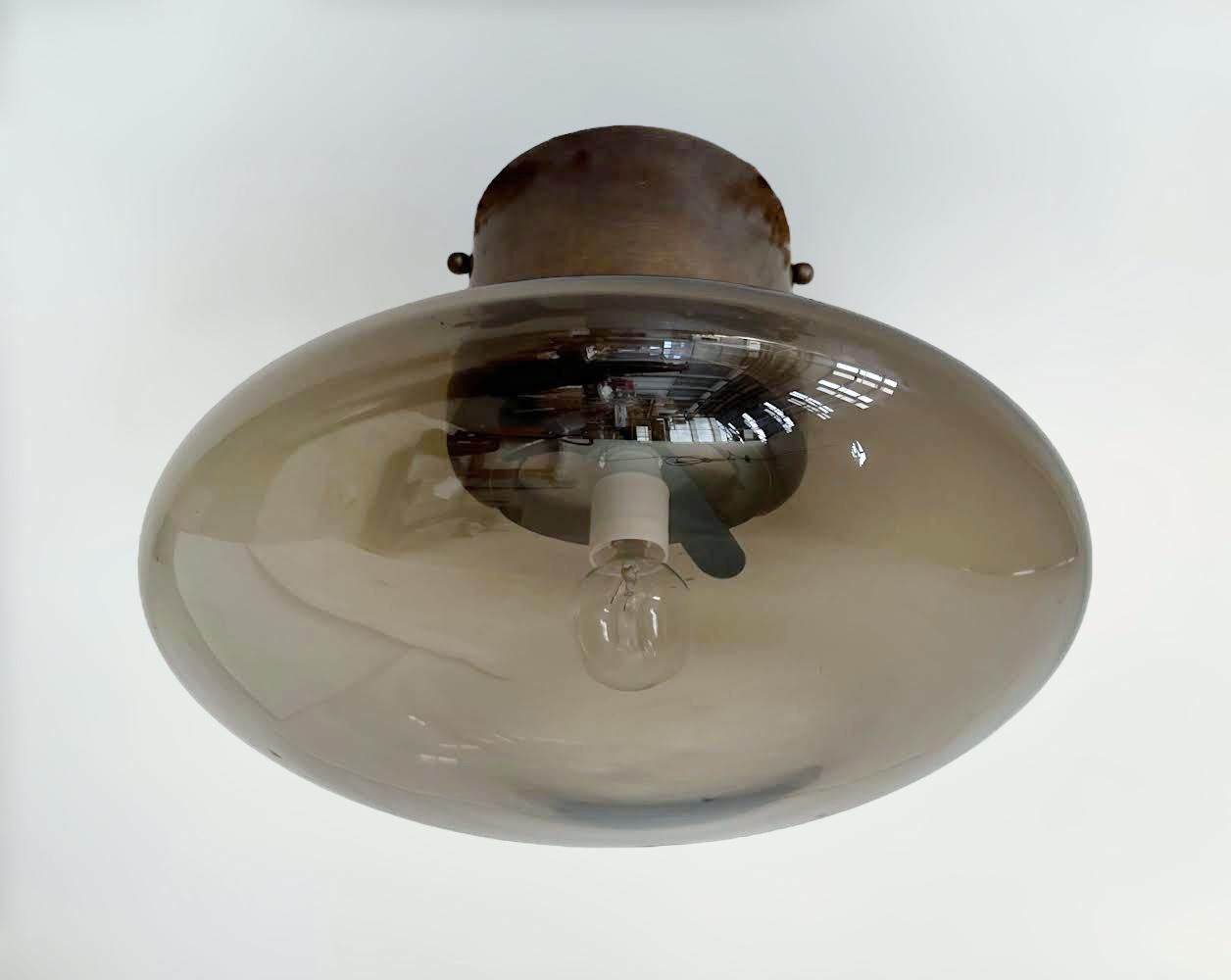 Italian flush mount with Murano glass shade and brass frame shown in bronzed finish / Made in Italy
Designed by Fabio Ltd, inspired by Angelo Lelli and Arredoluce styles
1 light / E12 or E14 type / max 40W each
Diameter: 12 inches / Height: 9.5