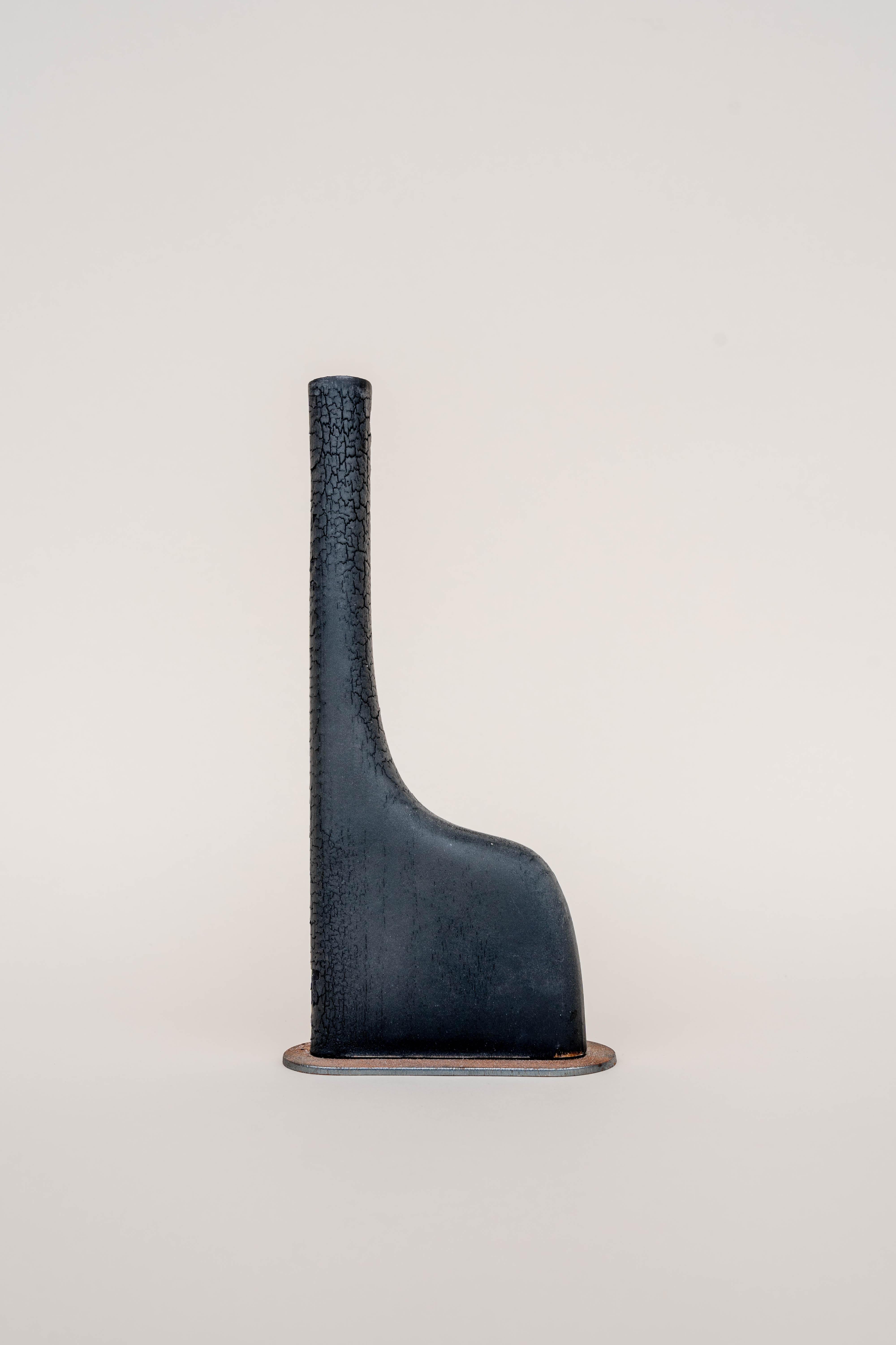 Uno vase by Daniel Elkayam
One of a kind
Dimensions: D 2.5 x W 10 x H 27 cm 
Materials: burnt poplar wood


Jerusalem-born Art-designer and Photographer based in Tel-Aviv. Operating in the field of sustainable home decor and specializing in