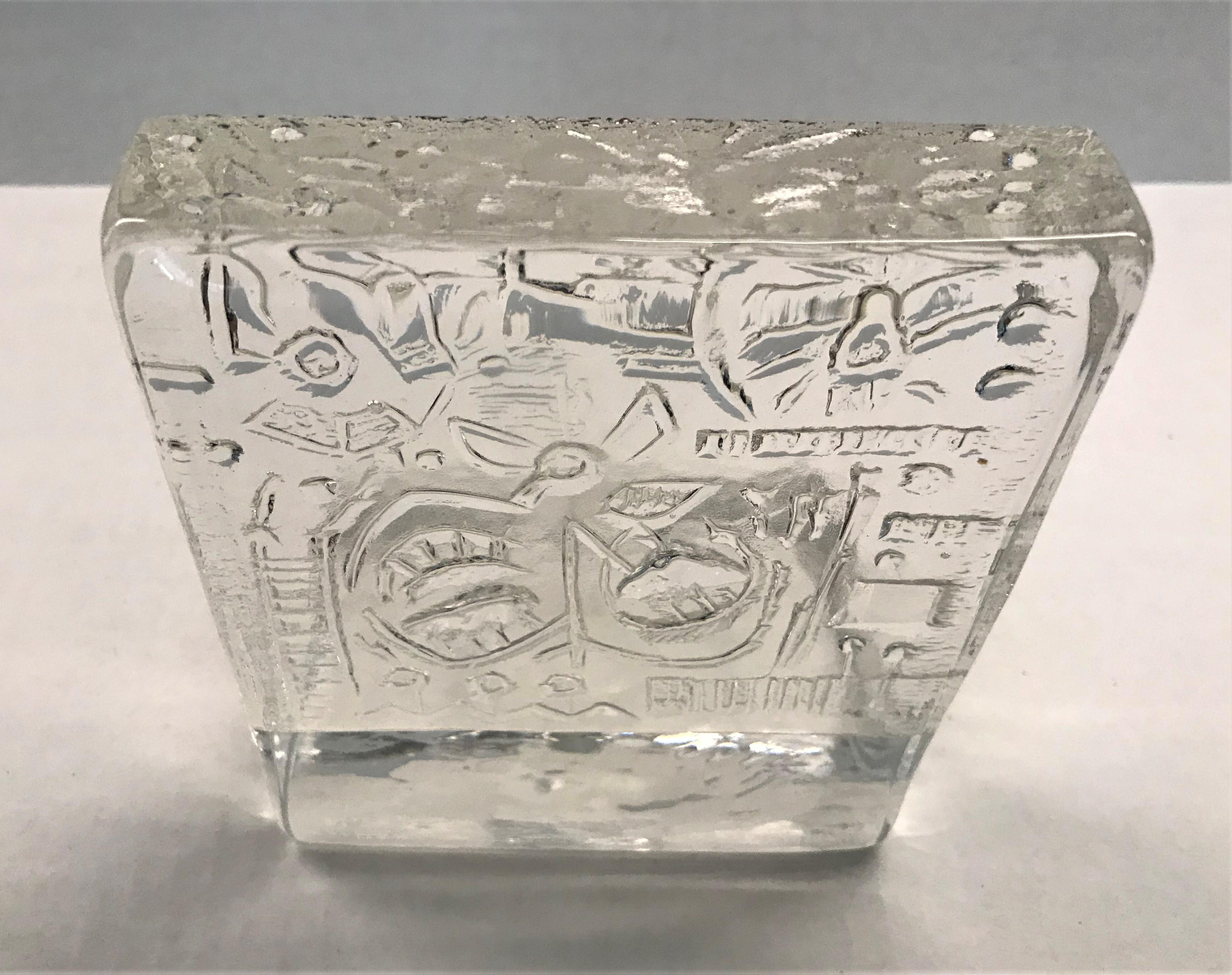 Here a 1970s glass screen tea candleholder by Uno Westerberg for Pukeberg, Sweden. The 1 1/8 inch thick glass front panel with a background in relief of stylized modern flower design while the front is smooth. Lovely effect when the tea candle is