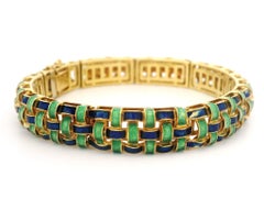 Bracciale UnoAErre in oro giallo 18 carati con smalto blu e verde, design a trama di cestino