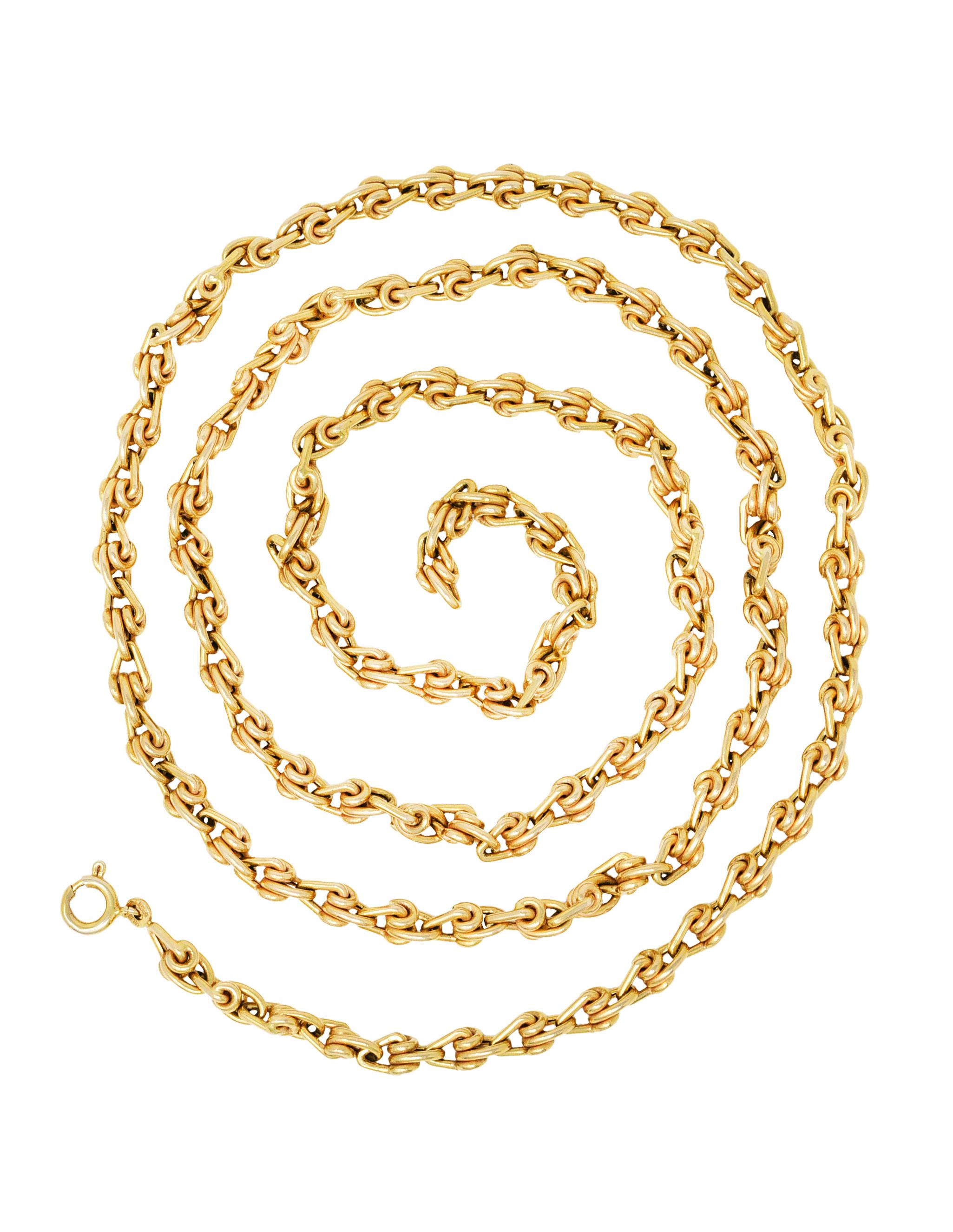 Long chain necklace is comprised of fabricated links

Designed as stylized interconnected coils

Completes as a spring ring clasp

Stamped 585 and 14K for 14 karat gold

Emblazoned Italy and signed Unoaerre

Length: 32 inches

Width: 3/16