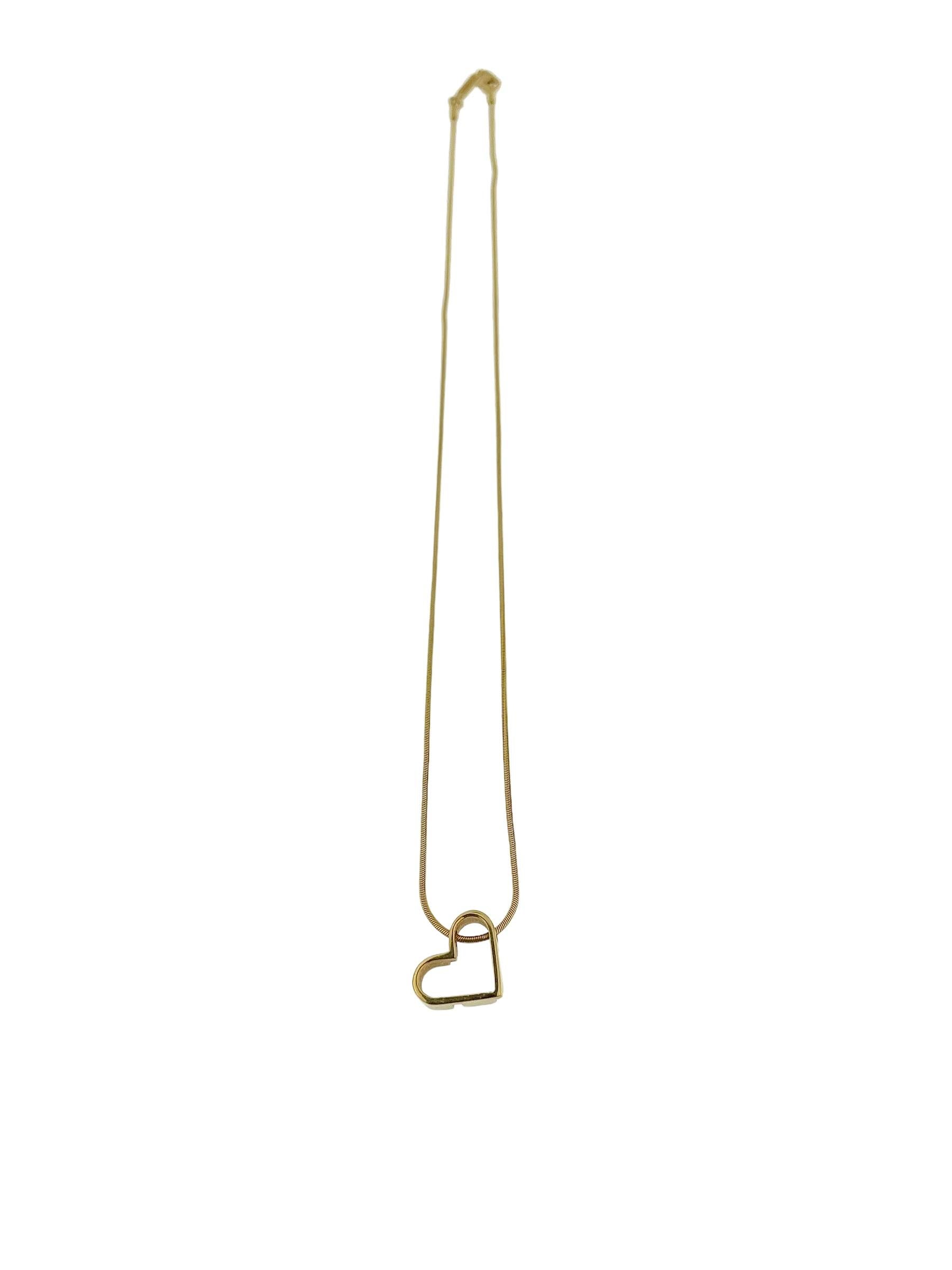 The UnoAErre Yellow Gold Necklace with Heart Pendant is a stunning piece of jewelry that exudes elegance and romance. Crafted from 18-karat yellow gold by UnoAErre, a renowned Italian jewelry brand, this necklace features a timeless tubogas-style