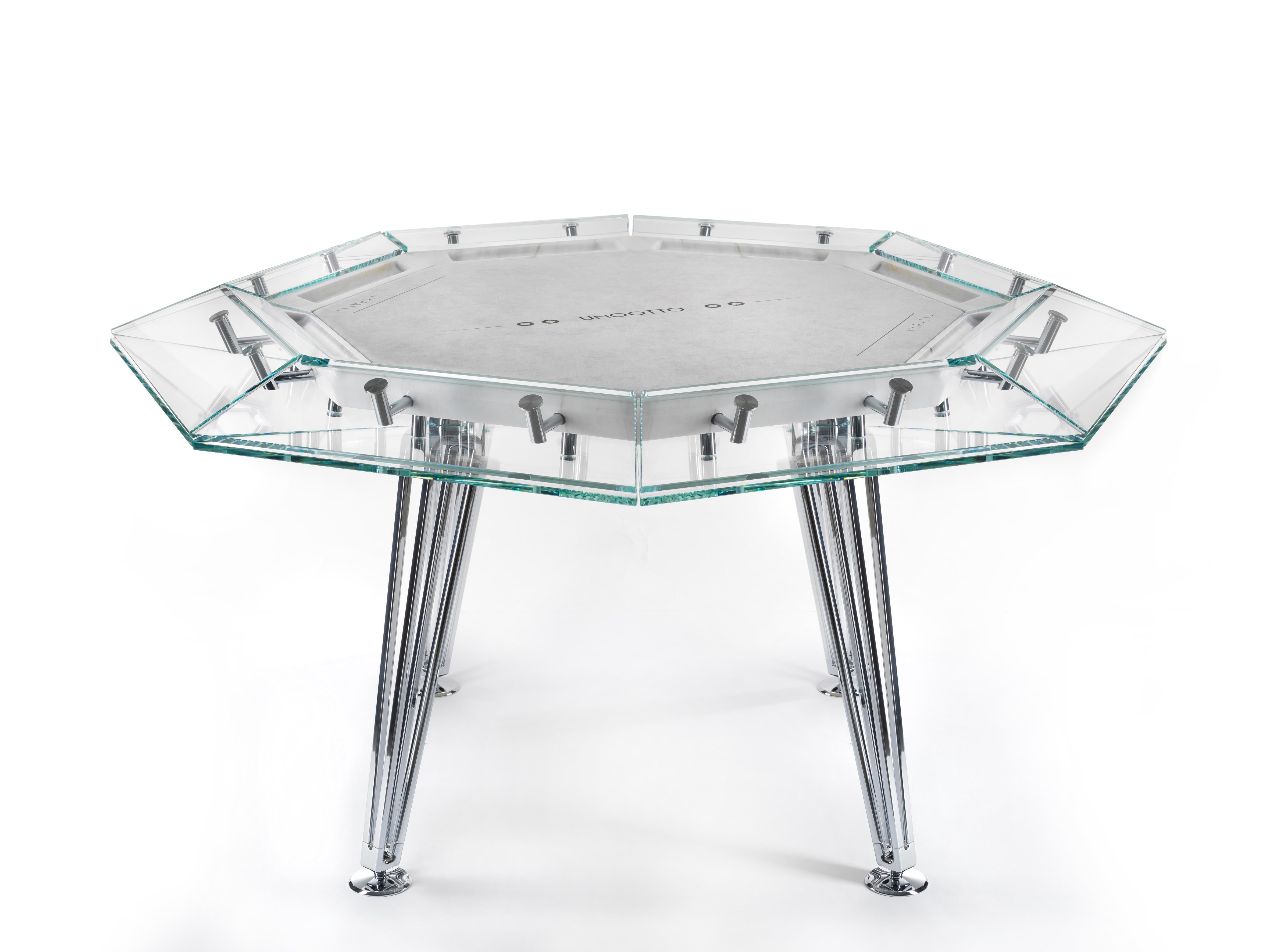 Unootto reinterprets the traditional professional poker table, making the A-game stylish and sophisticated.

This one-of-a-kind octagonal poker table features a unique low-iron glass top edge supported by an inner white marble top, finished off with