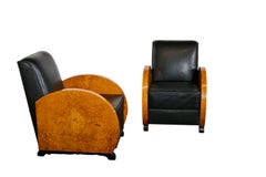 Unrestored Amboina armchair duo with black leather seats