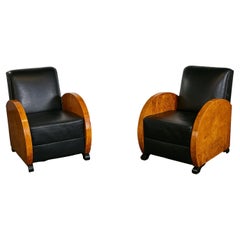 Unrestored Amboina armchair duo with black leather seats