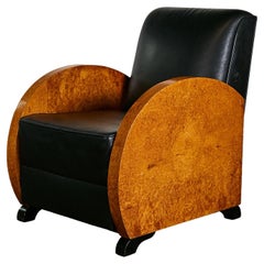 Unrestored Amboina armchair with black leather seat