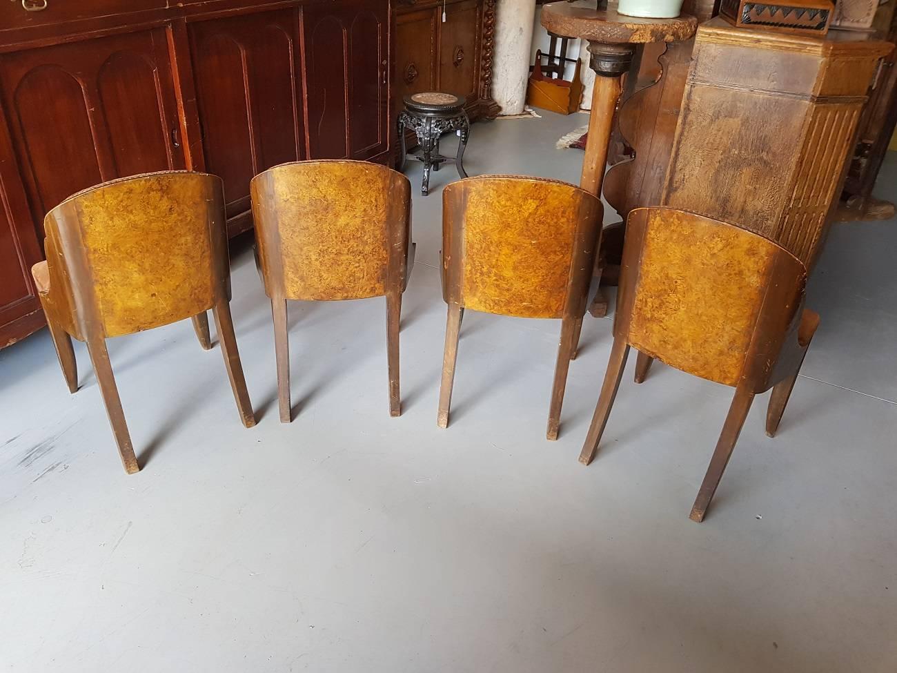 Set of four original and unrestored French Art Deco dining chairs from the 1920s-1930s with walnut veneered seat.

The measurements are,
Depth 52 cm/ 20.4 inch.
Width 46 cm/ 18.1 inch.
Height 82.5 cm/ 32.4 inch.
Seat height 46 cm/ 18.1 inch.
 