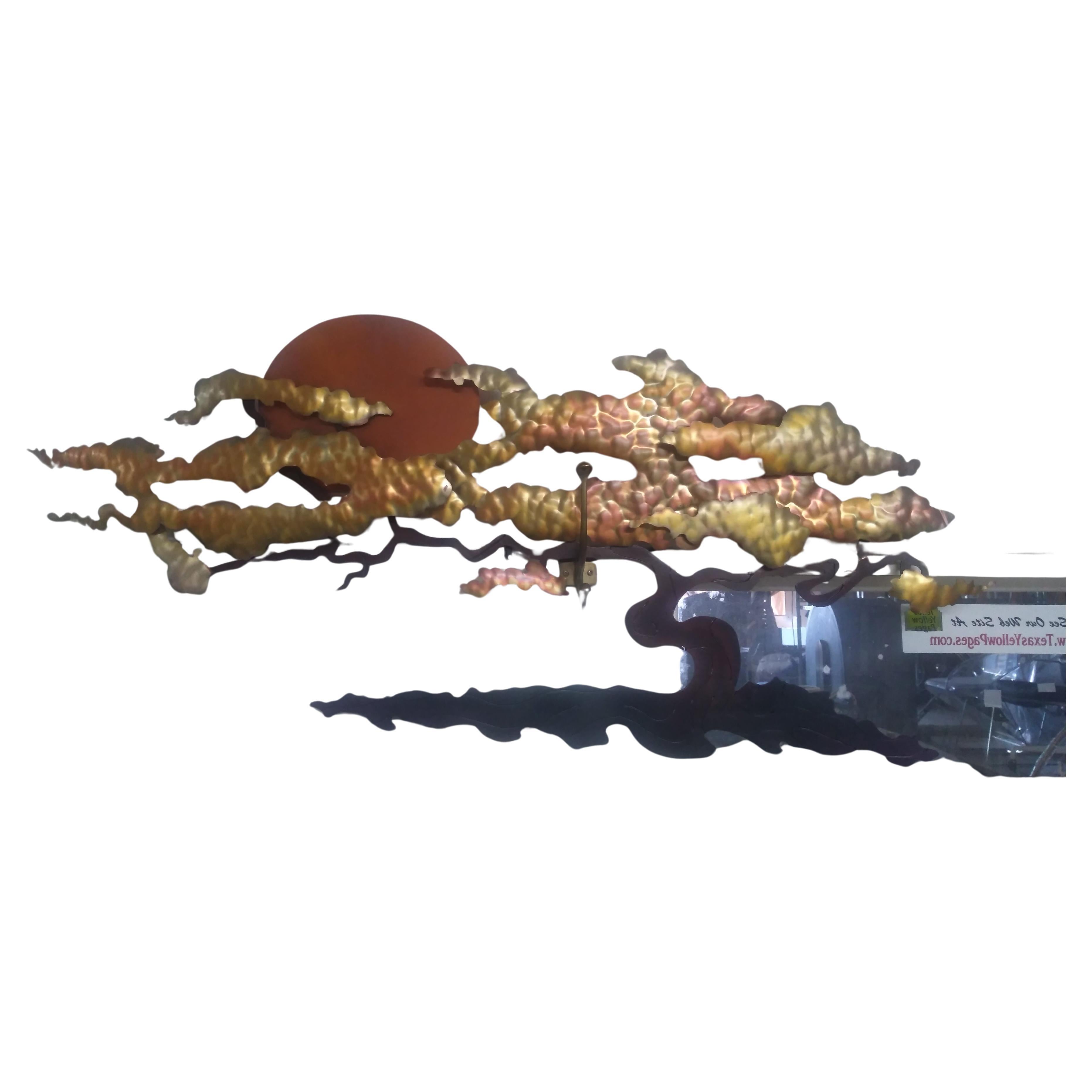 This is a nice sculpture by Bijan. It's made of copper and different metals. It's a hand crafted work of art depicting an Asian evening scene of the sun going down behind a bonsai tree. Some of the pieces are painted, by the artist, to bring about a
