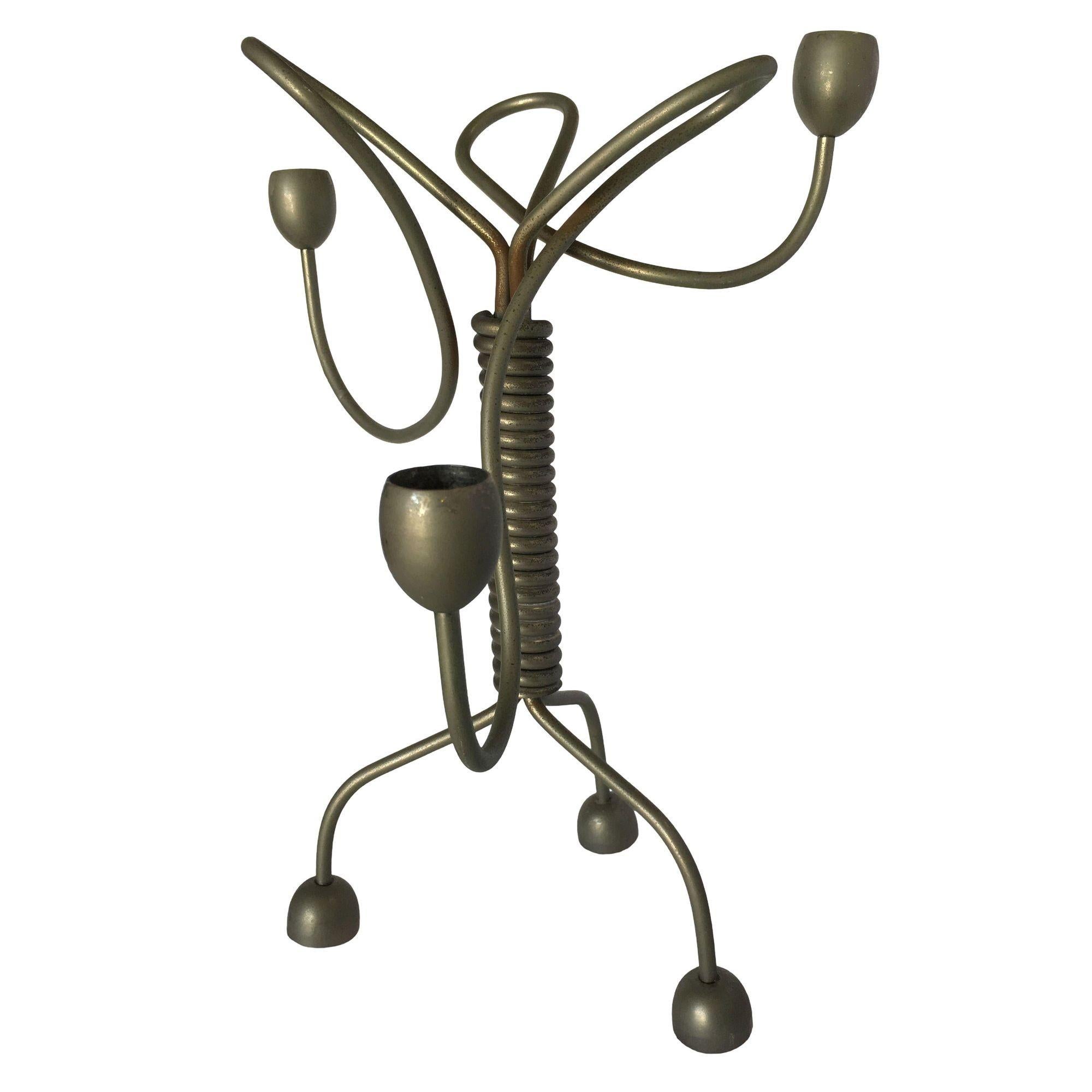 Unsigned custom made coiled wire abstract candelabra featuring 3 candleholders on 3 asymmetric freeform arms flowing out of a coiled center resting on 3 legs, circa 1960.