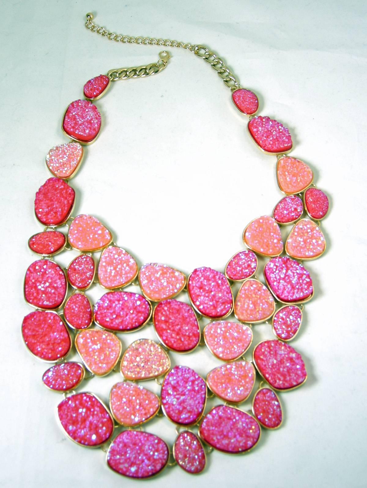I had this necklace in another color signed Oscar de la Renta, but this one is not signed … but still gorgeous.  It is created with different shades of Druzy crystallized stones in various shaped disks designed in an extravagant bib necklace. Each