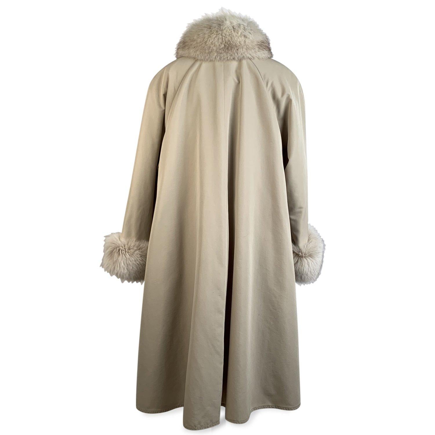 Vintage beige single breated Coat with Fox Fur Trim. Front button closure Fox fur trim on collar and on the cuffs in beige color. Removable sleeveless lining. Side slits with buttons.Size is not indicated. Estimated size is a MEDIUM size Details