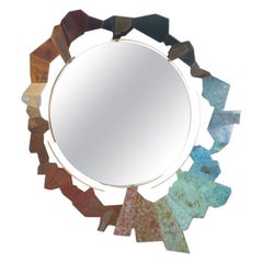 Unstructured bronze and oxidized brass mirror. Contemporary.