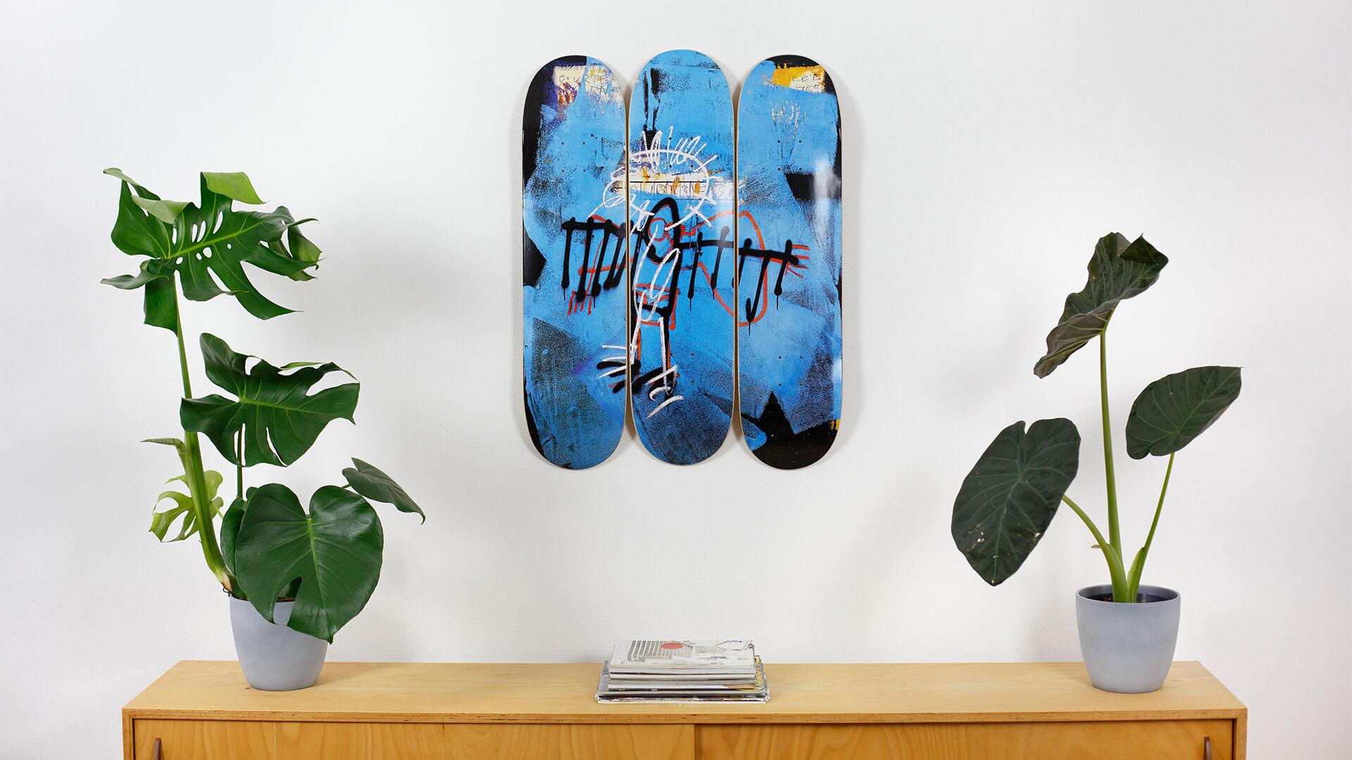 The Skateroom w/ Jean-Michel Basquiat Estate
based on Untitled (Angel), 1982
set of three skateboard decks
7-ply Canadian Maplewood with screen-print
each deck: 31 h. x 8 inches
installed dimensions: approx. 31 h. x 26 inches
mounting hardware
