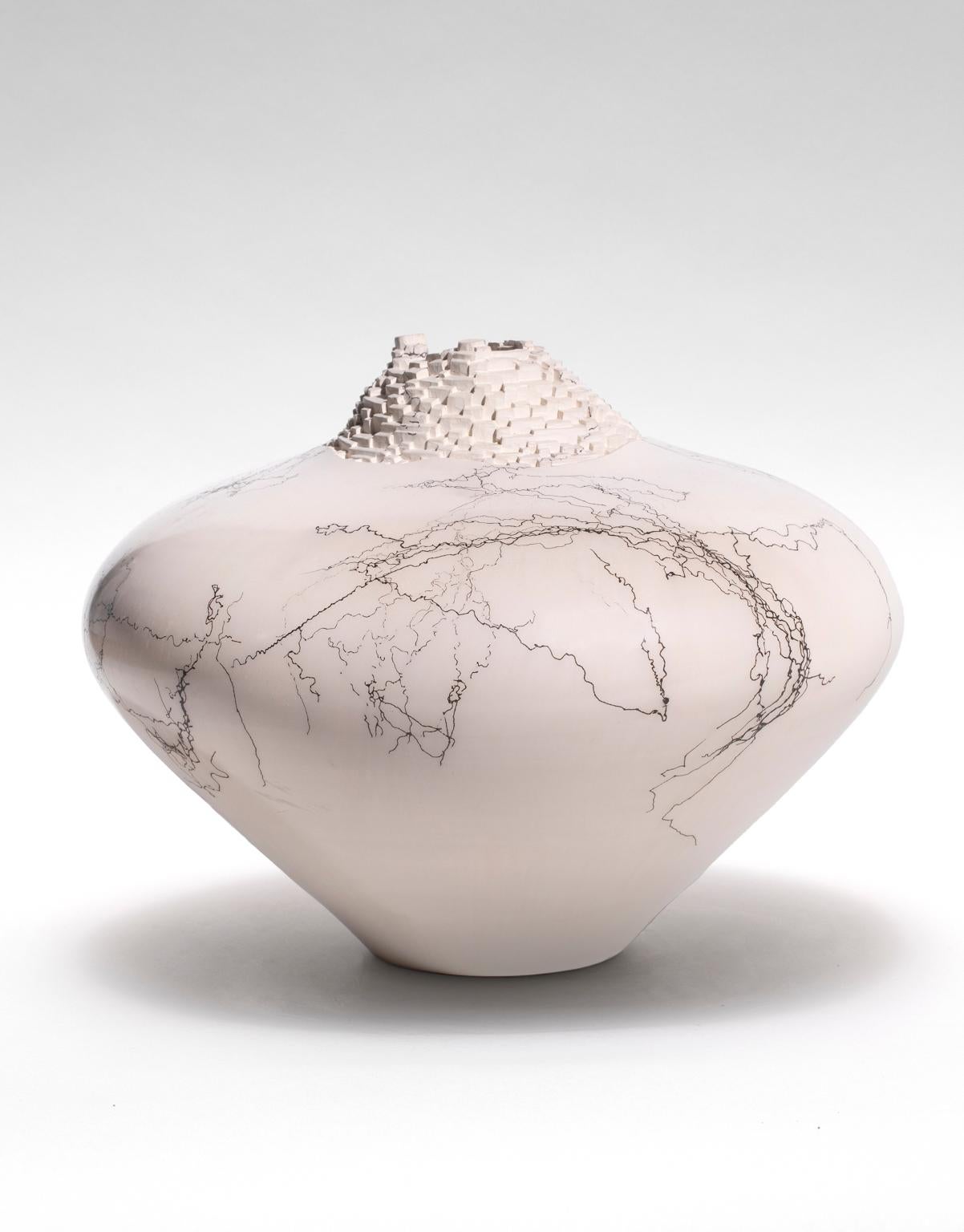 Jeff Margolin is a self-taught artist who works with a porcelain-type clay that is thrown or sculpted into forms with areas left for carving. They have a hefty yet delicate appearance and are quite lite in weight. The sculpted neck gives a nice