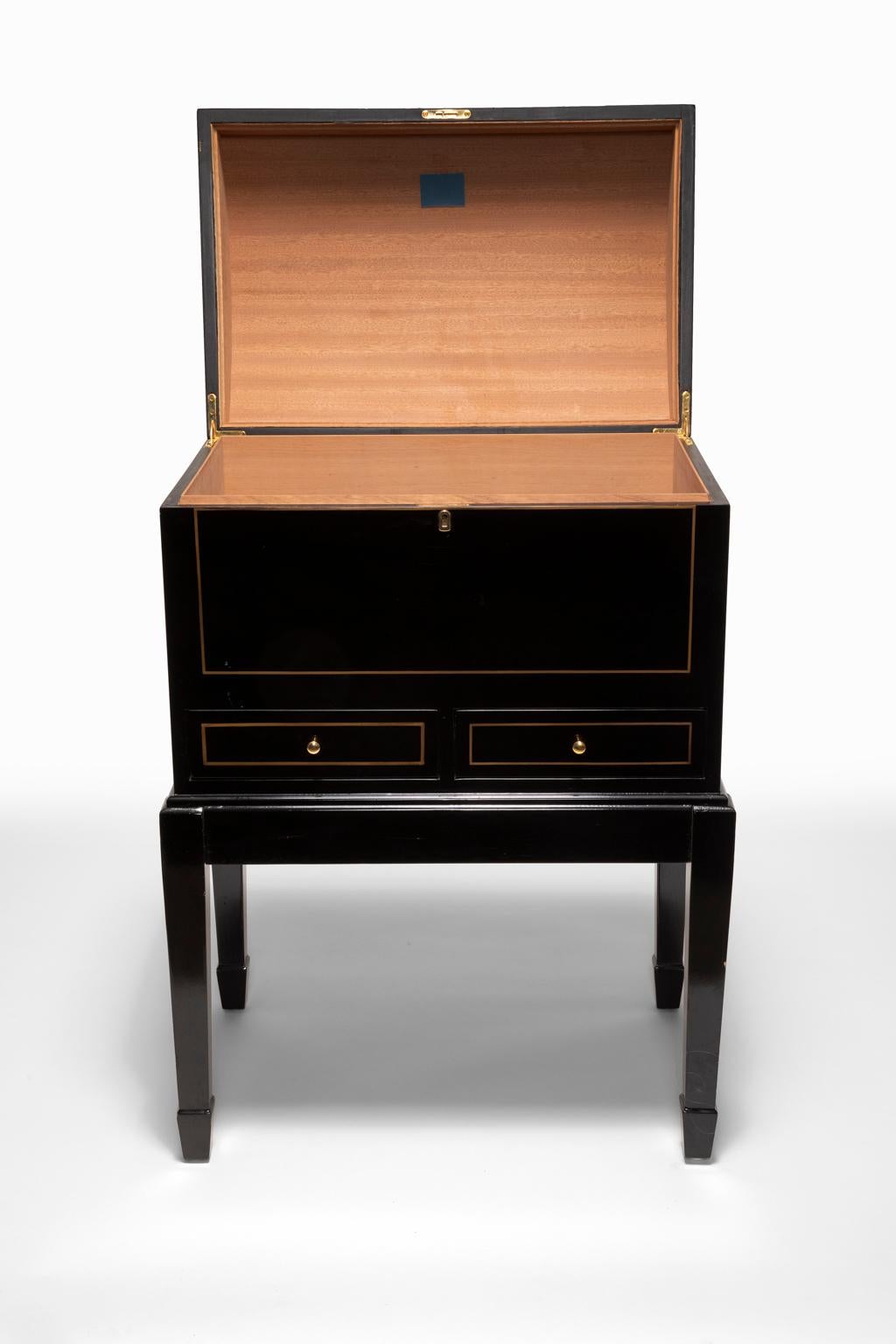 A Montecristo Humidor is the ideal way to always keep favorite select smokes fresh and ready to savor. This chest is designed to safely house cigars for a longtime. This stunning Humidor Cabinet is emblazoned with the Montecristo Crest and carries a