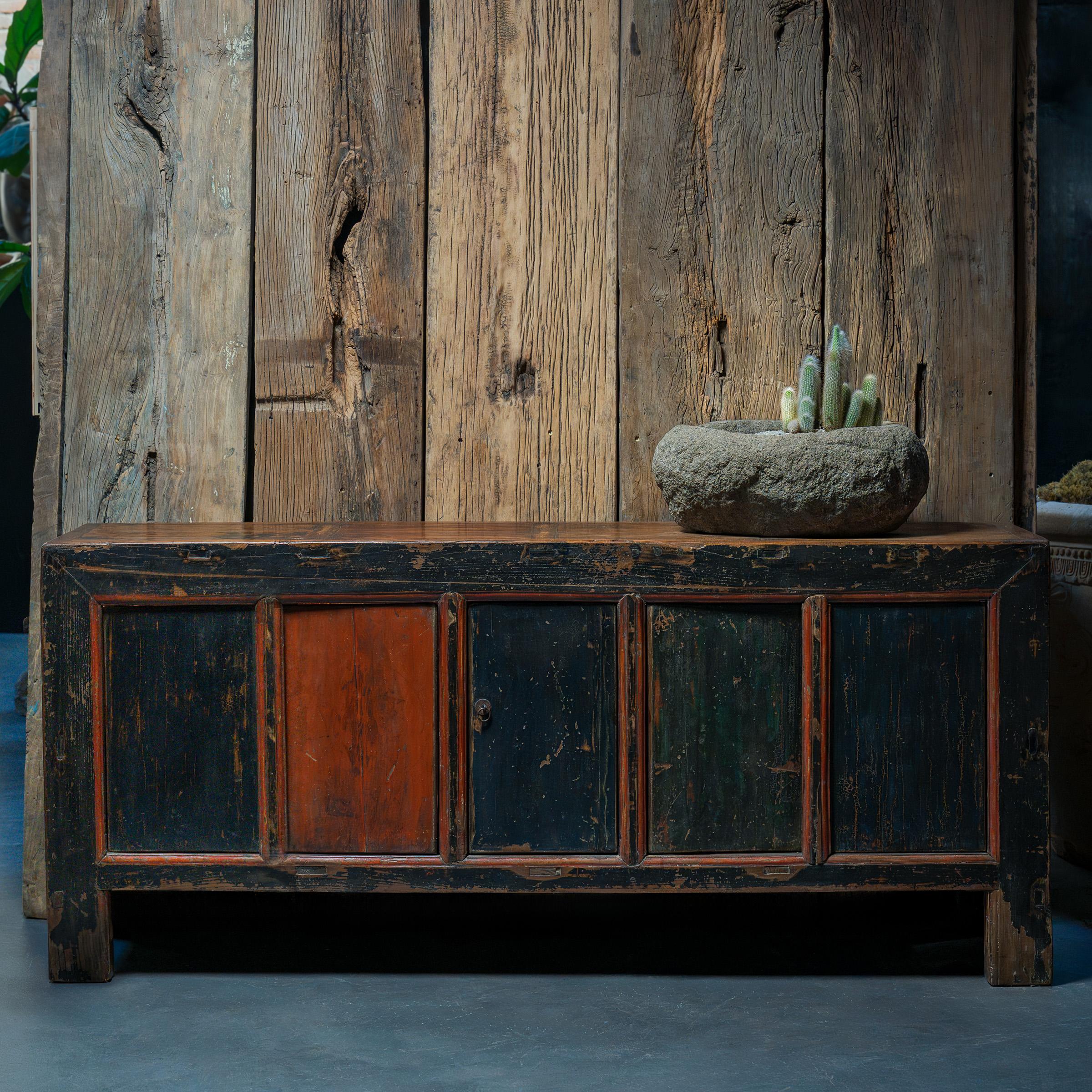 This early 20th-century coffer from Shanxi province has a streamlined design and plenty of rustic appeal. Originally configured to open from the top, the chest has been modified to open from the front by five rectangular panels converted into doors.