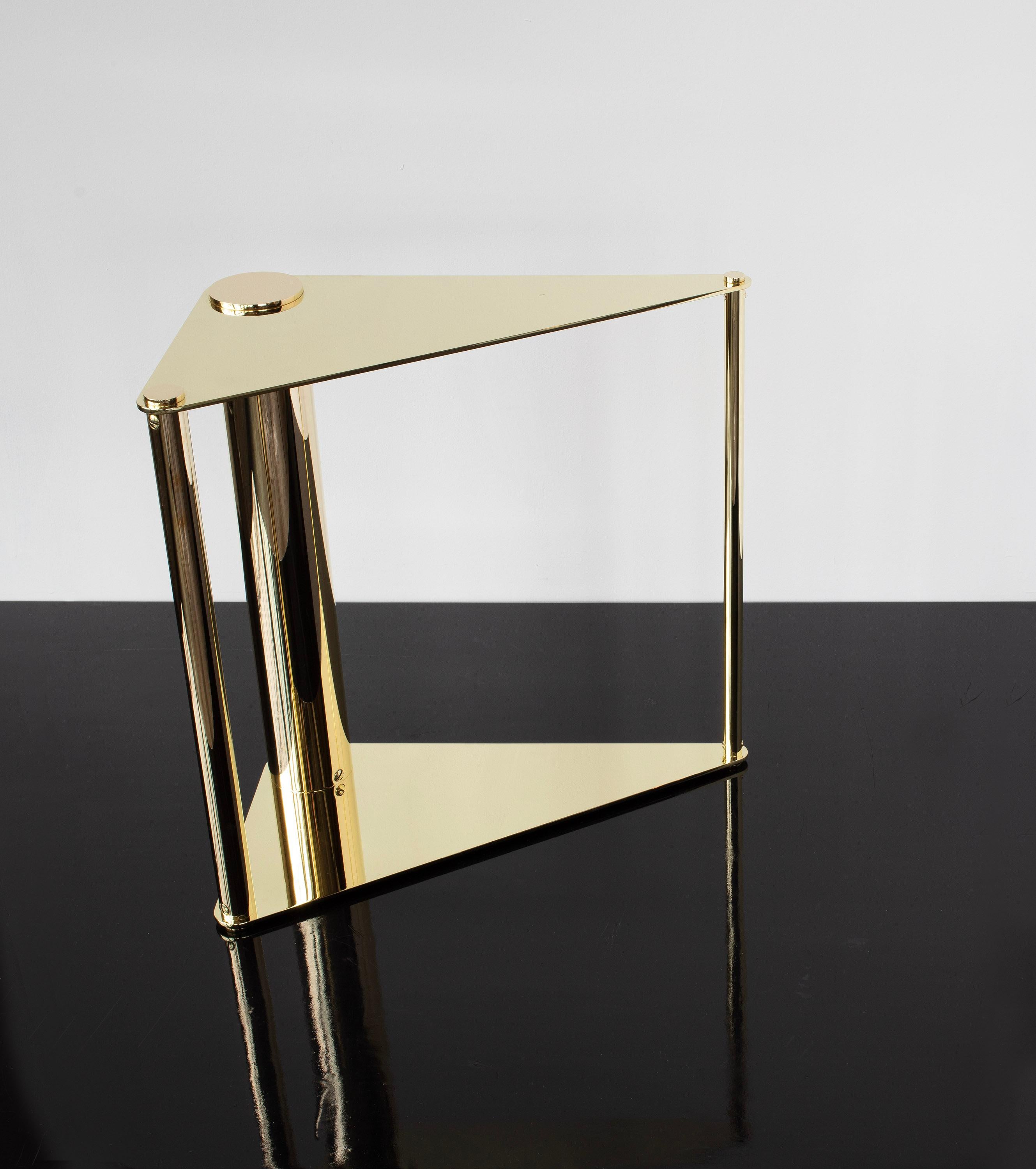 Solid machined brass with oval head slotted fasteners. The triangular design is completely reversible, being fully finished on both sides.  This allows the table to be flipped to either side so the angle of the triangle can be mirrored.  Petite