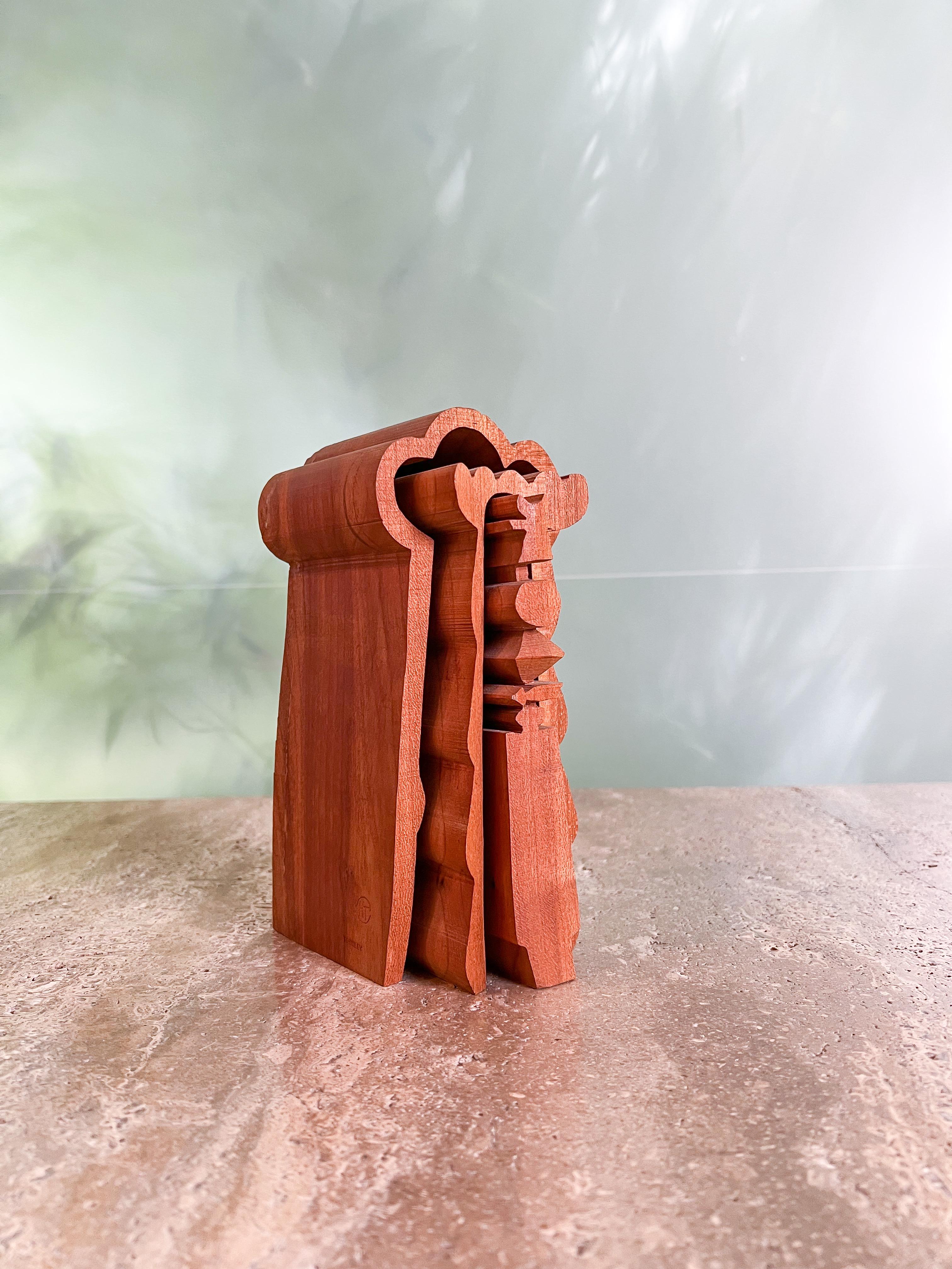'Untitled Spirit Place' is a nesting tabletop sculptor by American artist Hugh Townlely (1923-2008). Cut from red oak, this whimsical totem displays the artist's lifelong fascination with the abstracted form. Stamped 'TOWNLEY' along with the 'HT'