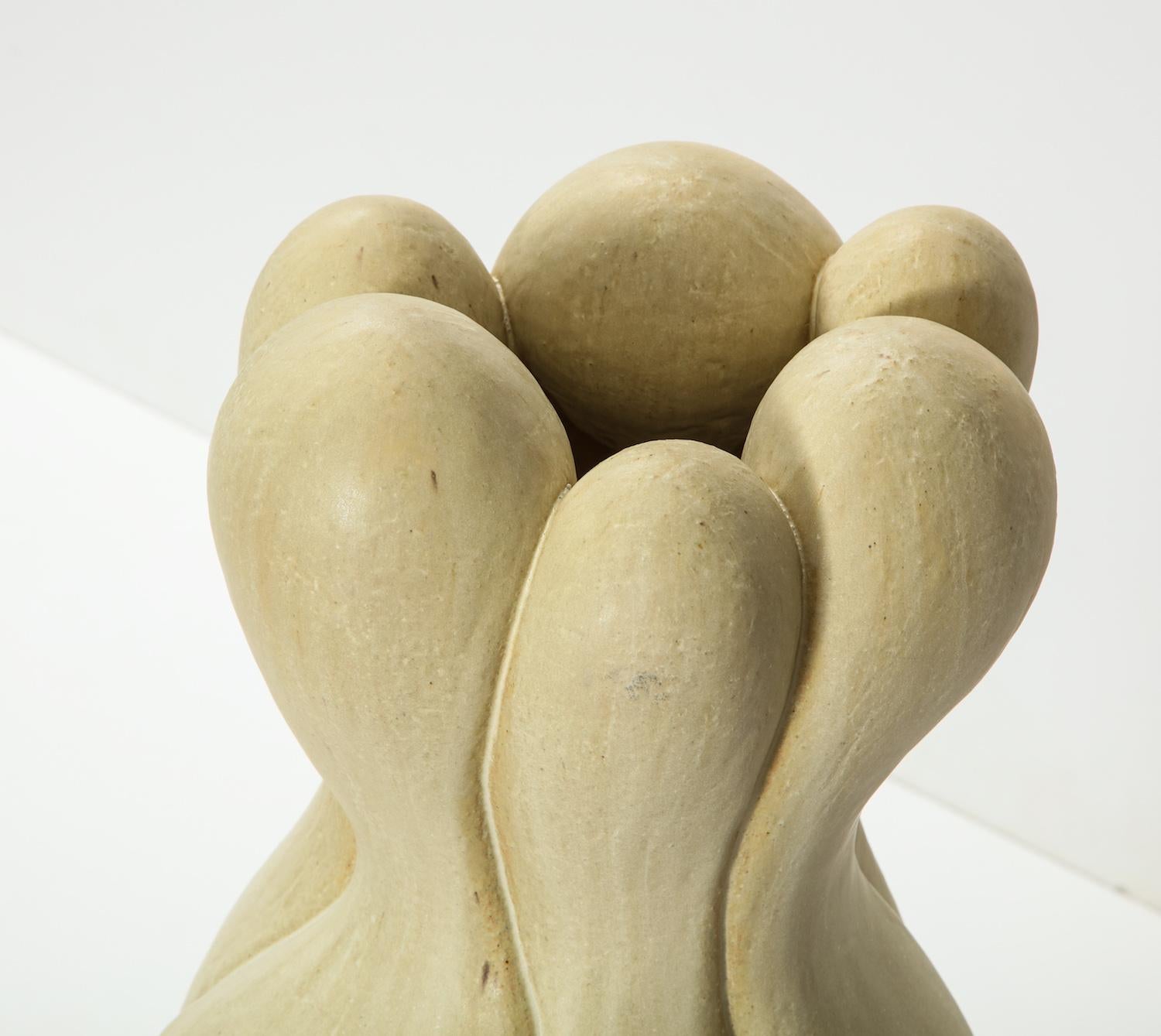 Large scale stoneware sculpture in cream colored glaze. Hand-built with open bottom.