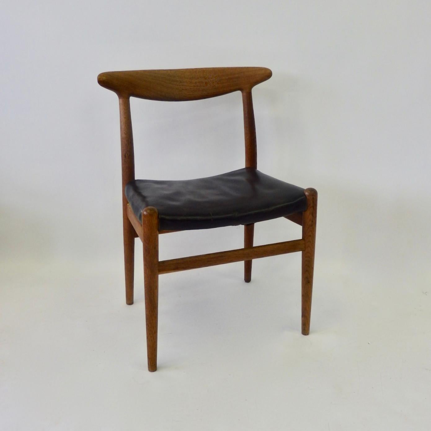 Completely original teak wood frame with black leather seat. Hans Wegner design dining or desk chair fabrik C.M. Madsen.