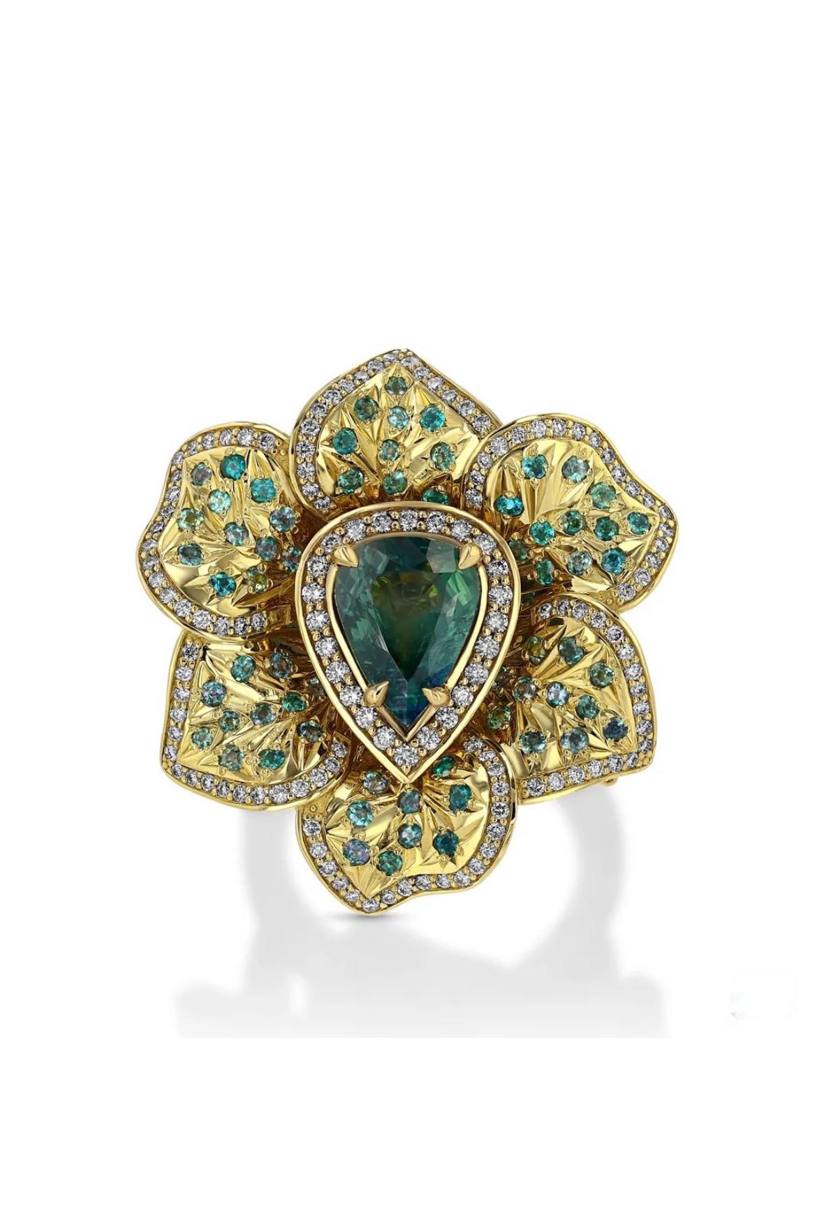 18K yellow gold ring, featuring an untreated 3.46-carat, pear-shaped Alexandrite from Orissa-India, accented with 76 round untreated Alexandrites from Brazil totaling 0.83 carats and 228 round brilliant-cut diamonds totaling 1.32 carats.

The color