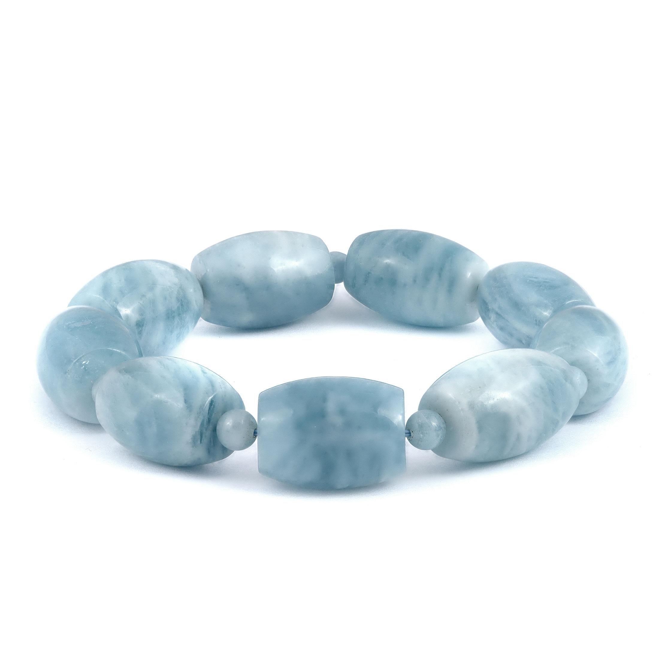 Discover the enchanting allure of natural aquamarine with this stunning bracelet, designed to add a touch of sophistication to any jewelry collection. Featuring multiple untreated aquamarine beads, this bracelet showcases the serene blue hue and
