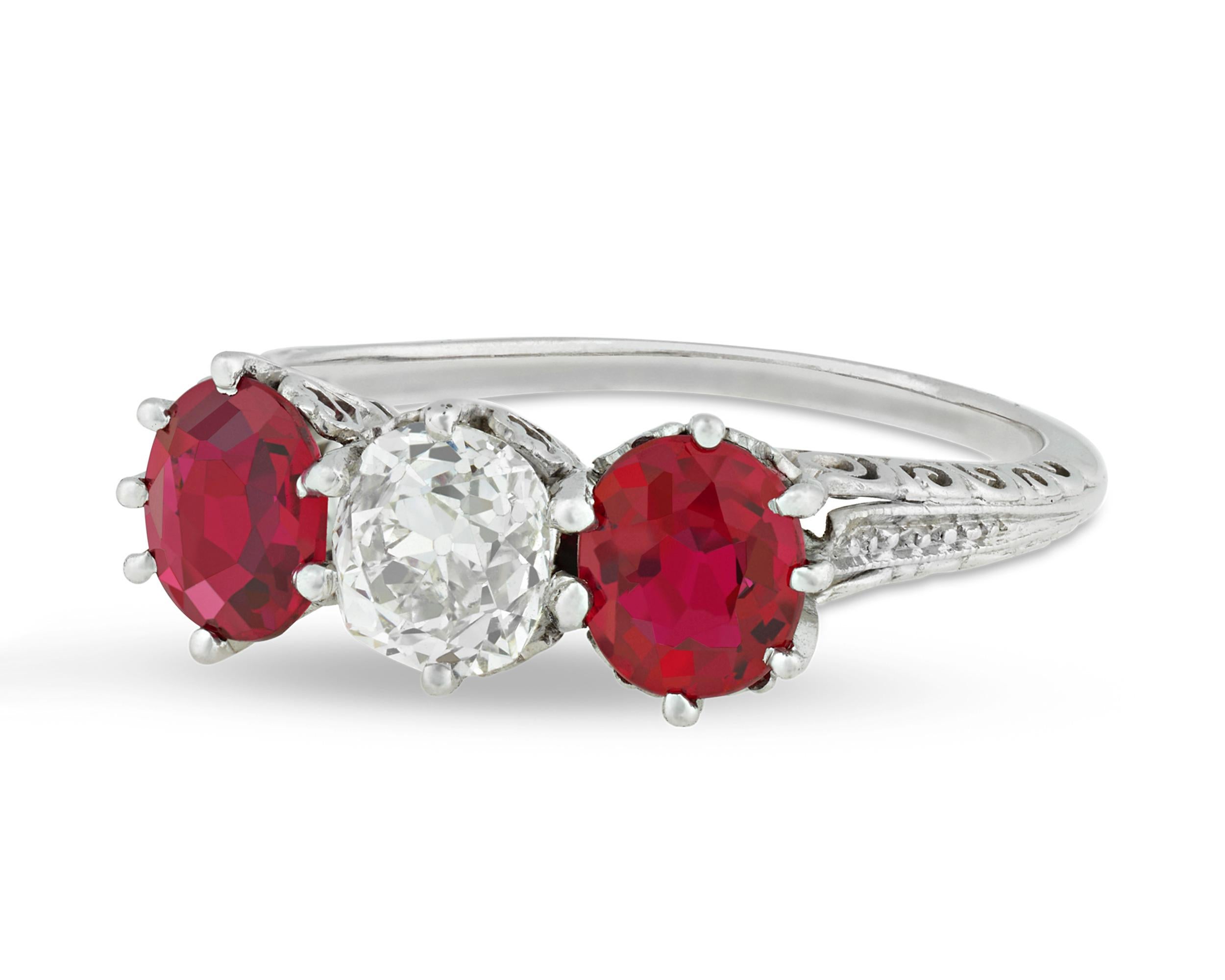 The beautiful Burma rubies in this classic three-stone ring radiate with the perfect 