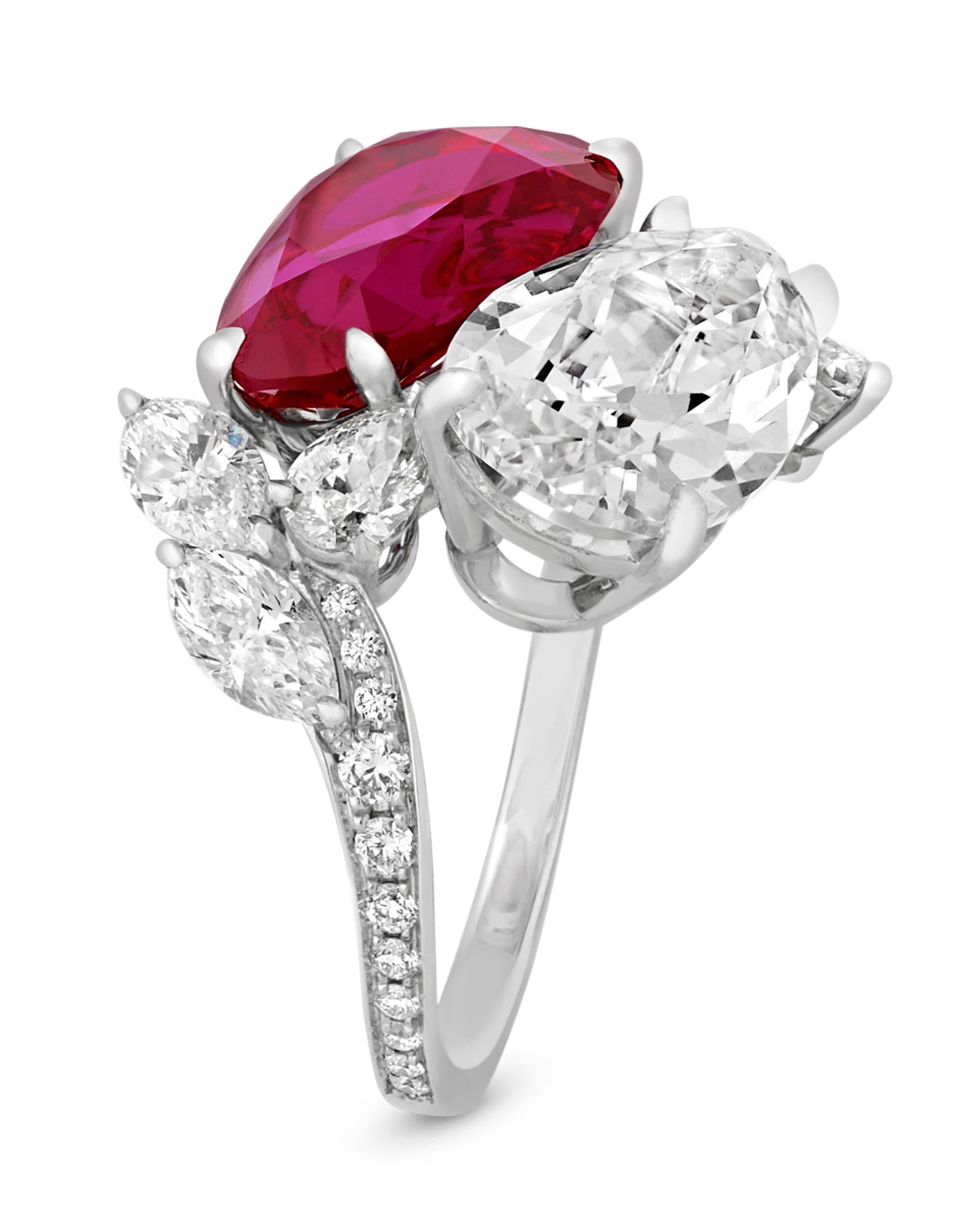 The exquisite 5.70-carat ruby and 4.54-carat diamond showcased in this bypass ring create a tantalizing interplay. The pear-shaped crimson gemstone is certified by the American Gemological Laboratories as being Burmese in origin and all natural,