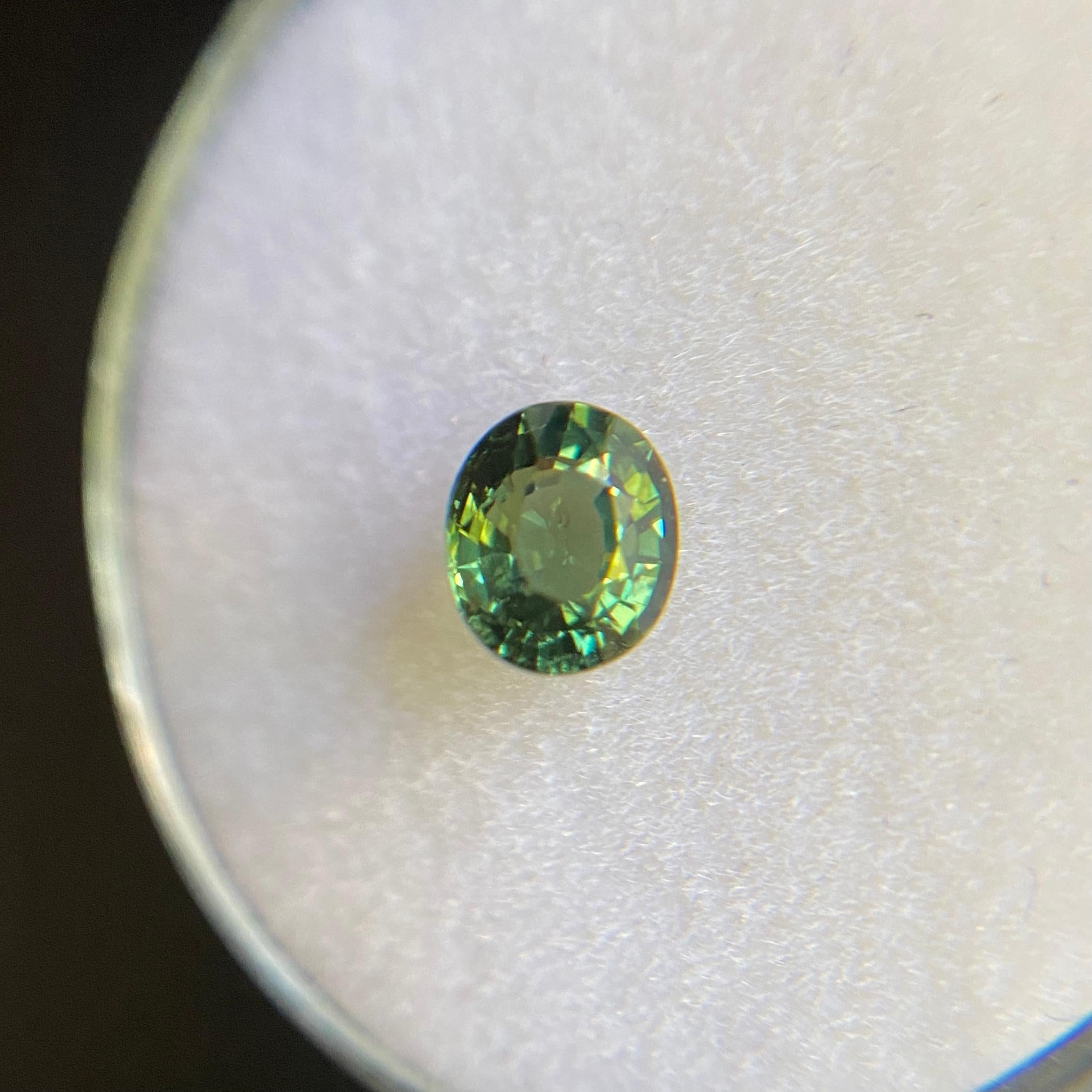 Natural Untreated Green Sapphire Gemstone.

0.71 carat stone with a beautiful green colour and good clarity, a clean stone with only some small natural inclusions visible when looking closely. Also has an excellent cut and polish to show great shine