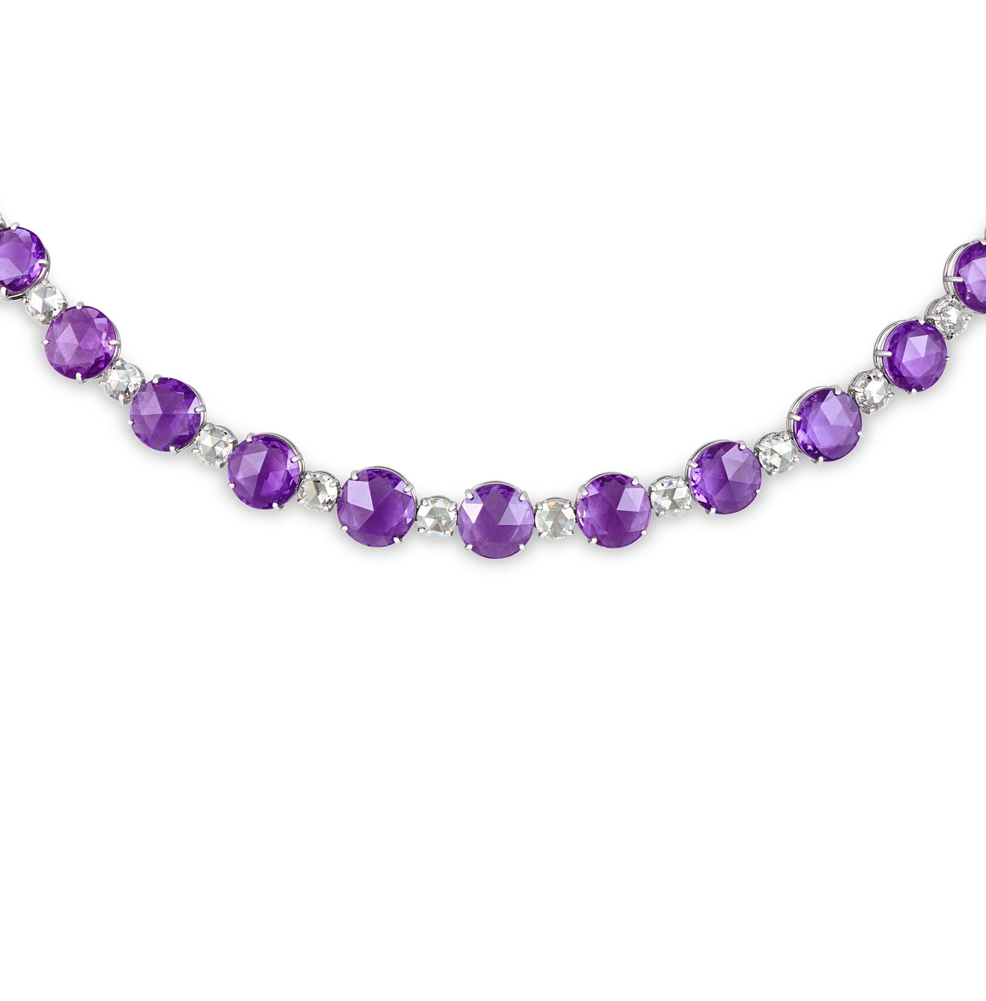 This striking and elegant necklace features luminous purple sapphires and glittering white diamonds. The thirty-one sapphires, totaling 47.52 carats, display a coveted lilac hue. The jewels are certified by C. Dunaigre as being all-natural, with no