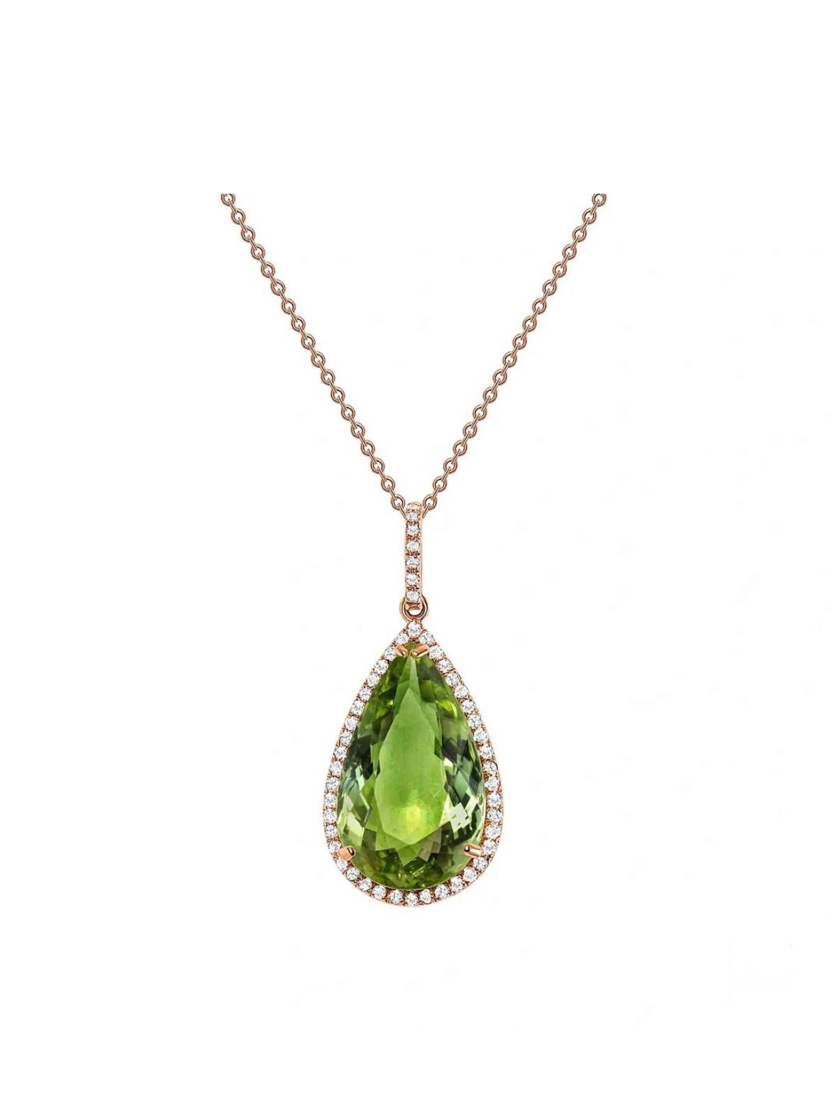 A splendid 7.32-carat untreated green Tourmaline from Mozambique takes the limelight with round shimmering diamonds totaling 0.27cts in this beauteous 18K yellow gold pendant. GIA certified. 

This copper and manganese bearing tourmaline may be