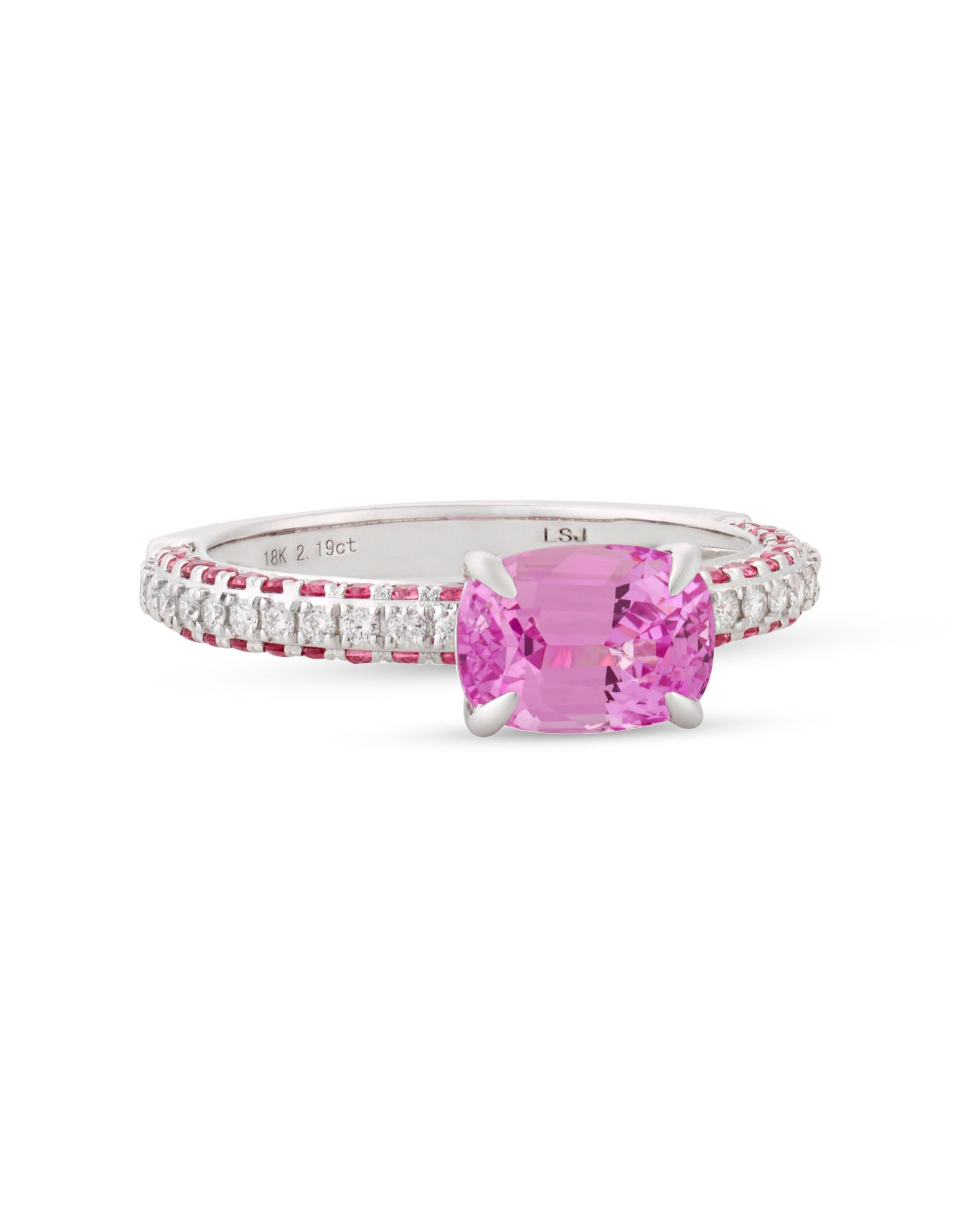 The 2.19-carat untreated pink sapphire in this ring exhibits a distinctive, saturated pink hue, among the rarest and most valuable colors in which to find one of these stones. This cushion-shaped gem is certified by Lotus Gold as a no-heat pink