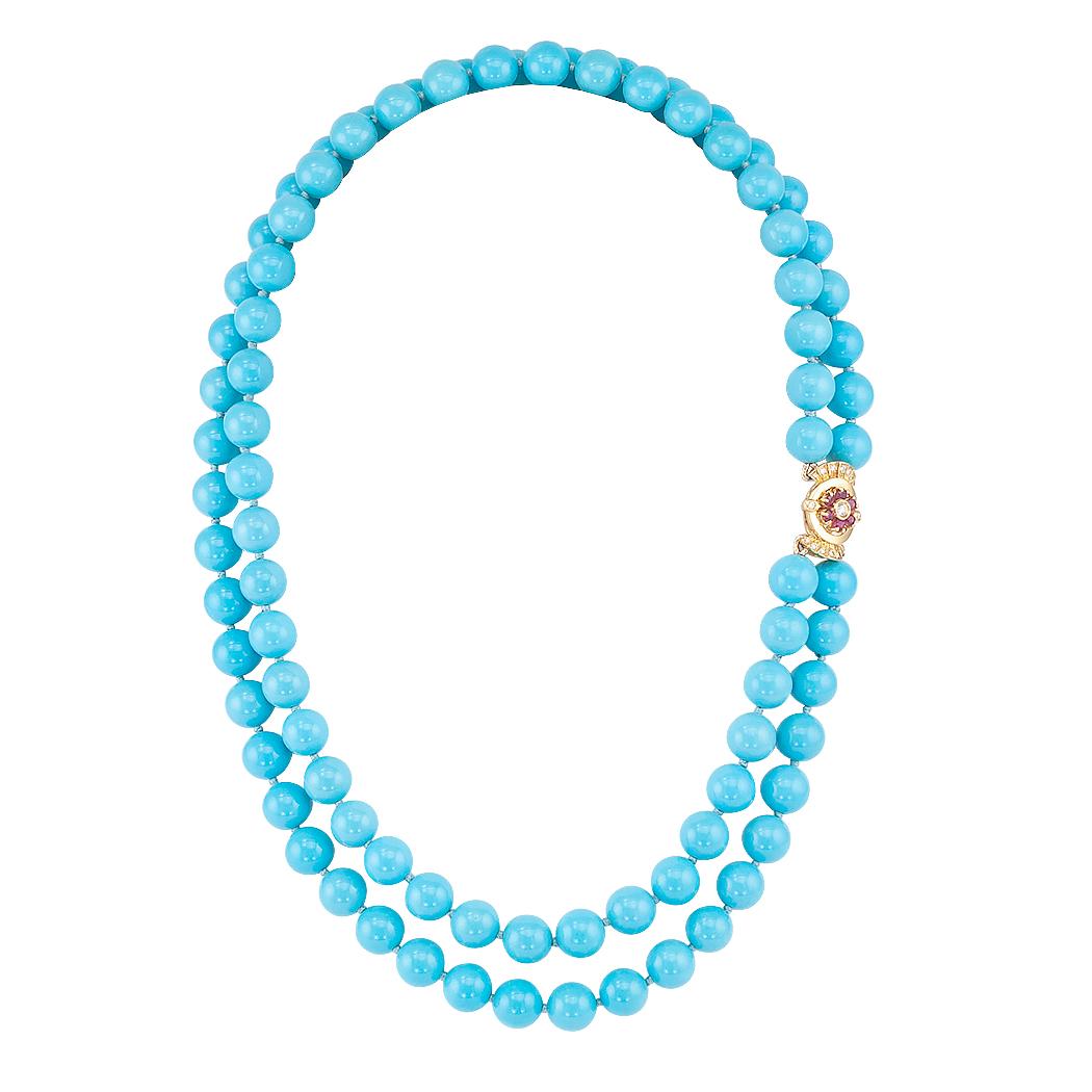 Untreated Sleeping Beauty turquoise bead necklace with ruby diamond and gold clasp. Comprising two nested strands of Sleeping Beauty Mine turquoise beads measuring approximately 8.75 – 9.24 mm., completed by an 18-karat gold clasp set with rubies