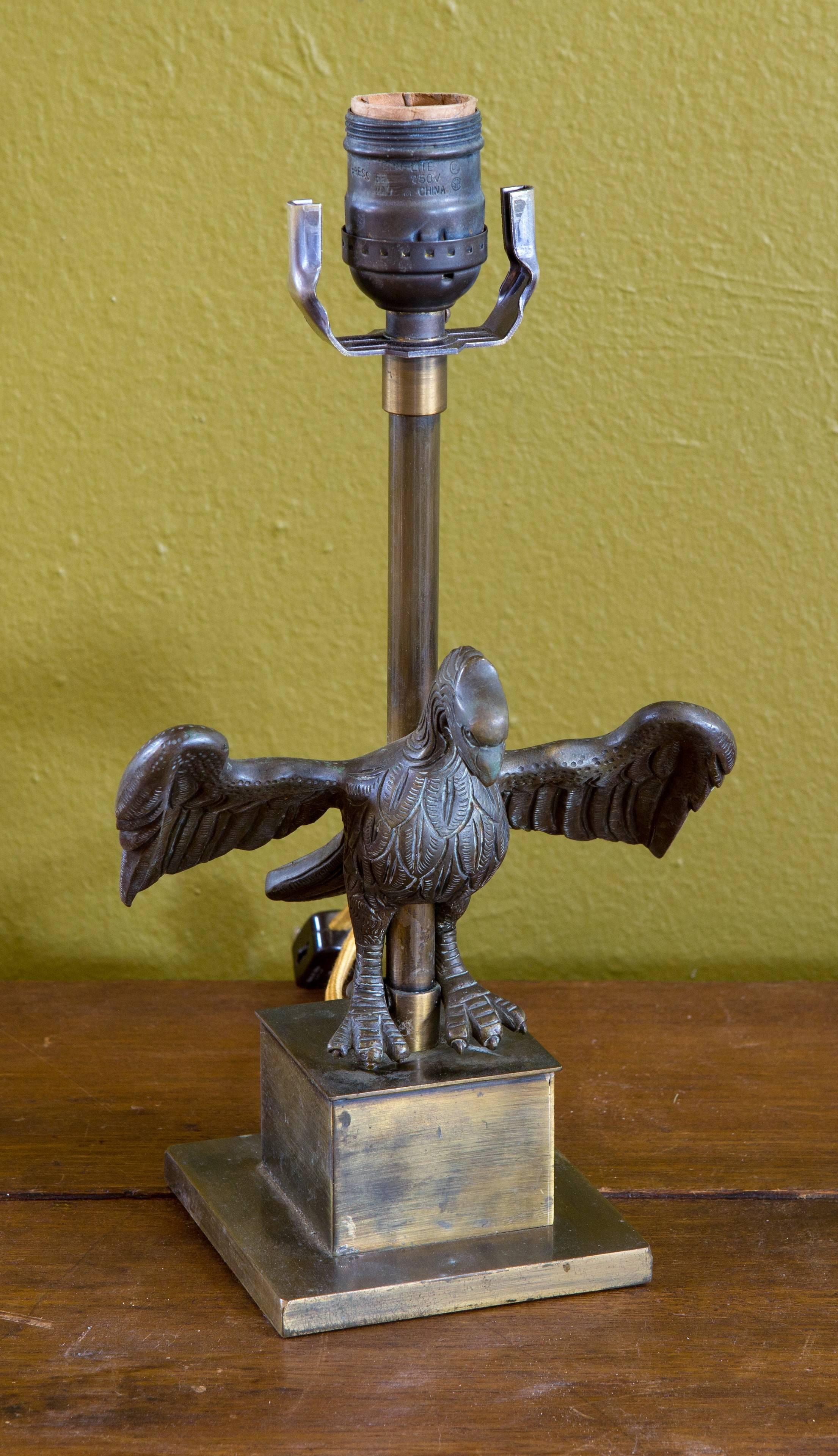 Petite one- of-a-kind bronze eagle table lamp, circa 1930s. Would be great for a study or on a small desk. Quite charming and of very nice quality. Would also be interesting tucked into a bookshelf.

He is just so charming and different.

It has