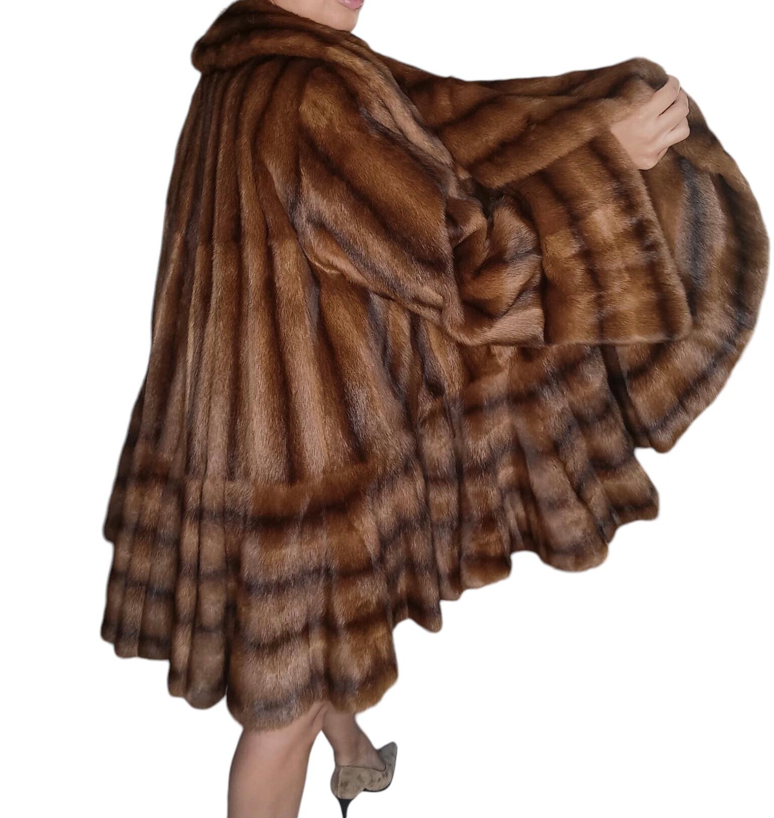 PRODUCT DESCRIPTION:

Unused Birger Christensen Demi Buff Swing wide Extra wide Sweep Mink Fur Coat (Size-24/2XL)

Renowned Birger Christensen  label, very wide sweep skirt, impeccable supple fur, vibrant Colors, 100% silk lining.

Condition: