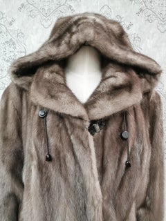 Unused blue iris mink fur coat with a hood size 12