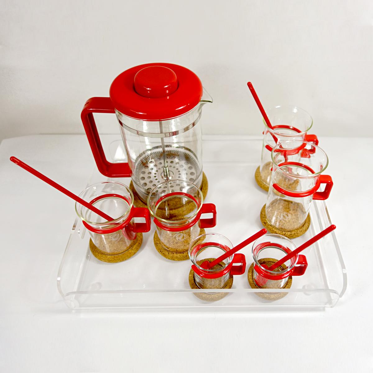 This refined yet striking coffee set was made for two. It is complete and still new as it has never been used. It consists of a French press, two coffee glasses, two espresso glasses, two latte glasses, four tea spoons, seven coasters and a