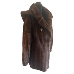 Unused demi buff mink fur coat with a hood size 10 Unused demi buff mink fur coat with a hood size 10